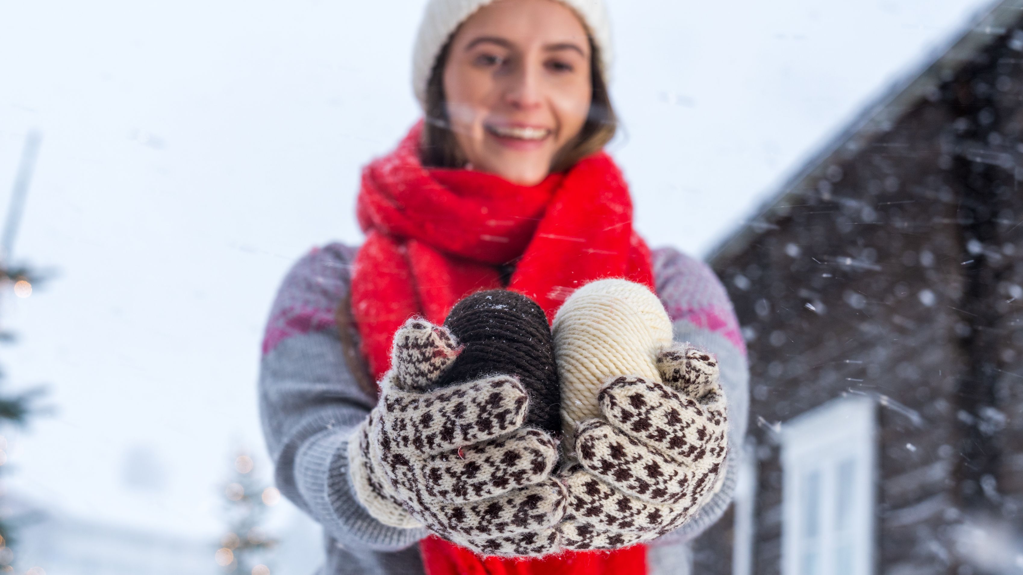 A woman holding yarn used to make Selbu mittens, Trøndelag, Norway.