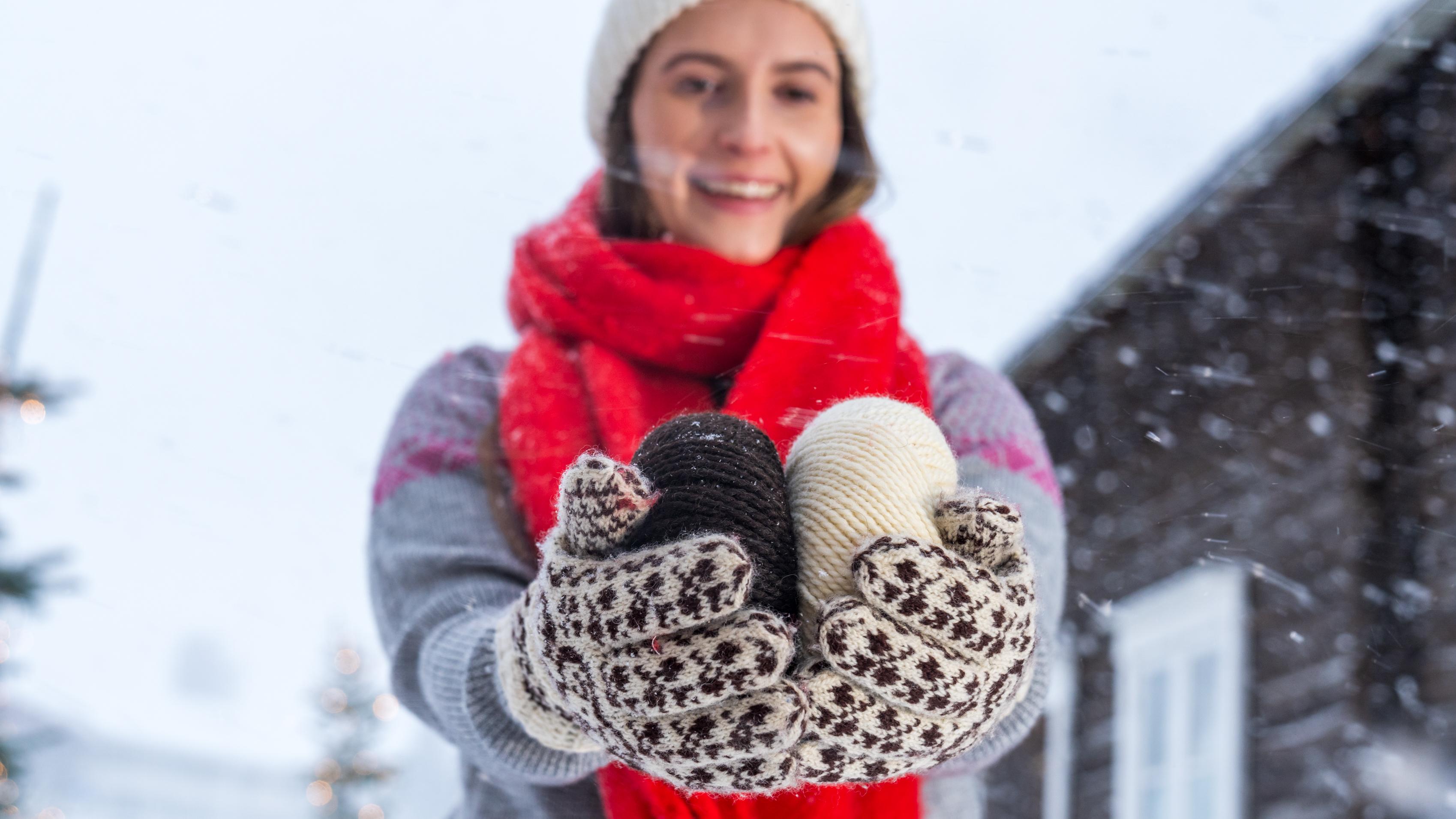 A woman holding yarn used to make Selbu mittens, Trøndelag, Norway.