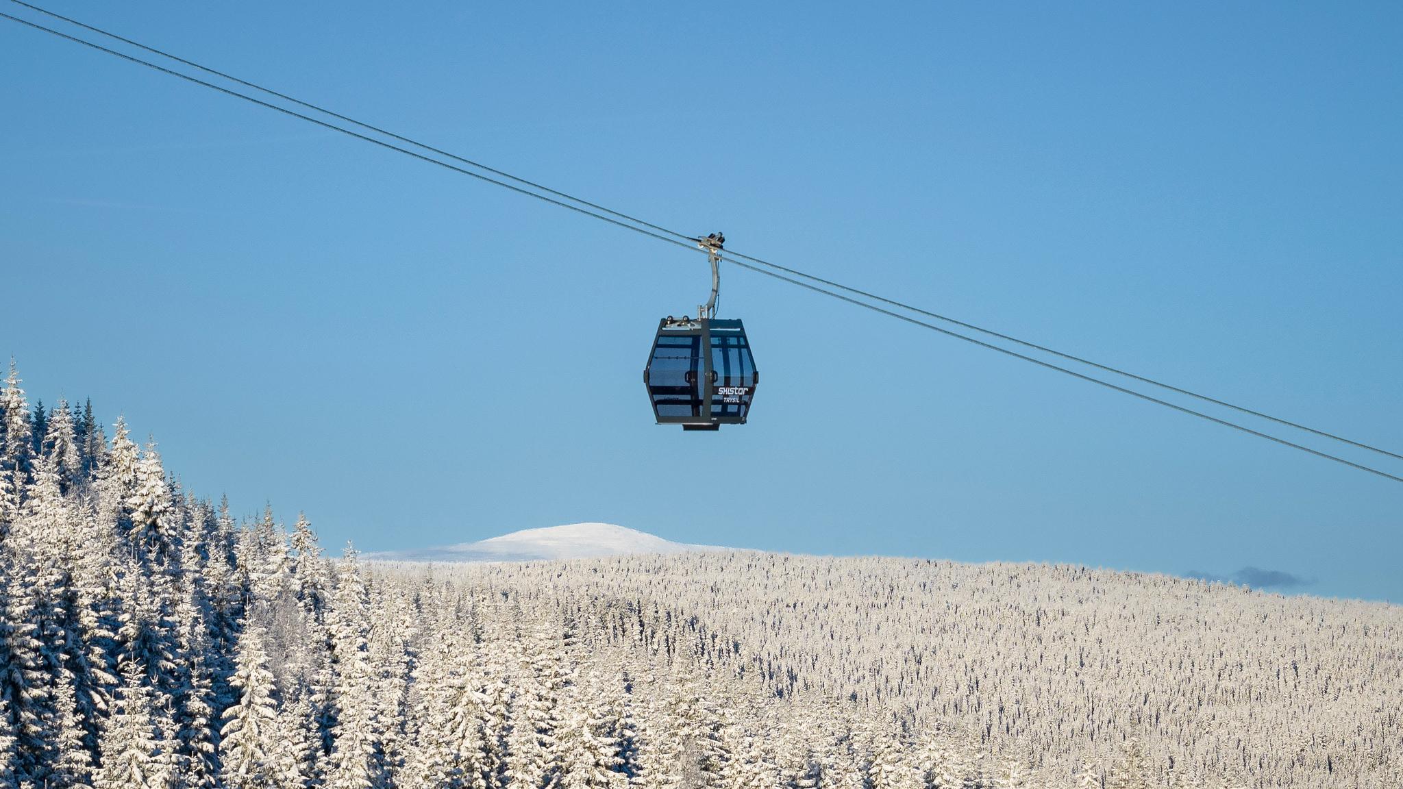 A ski gondala over snow capped fores in Trysil.