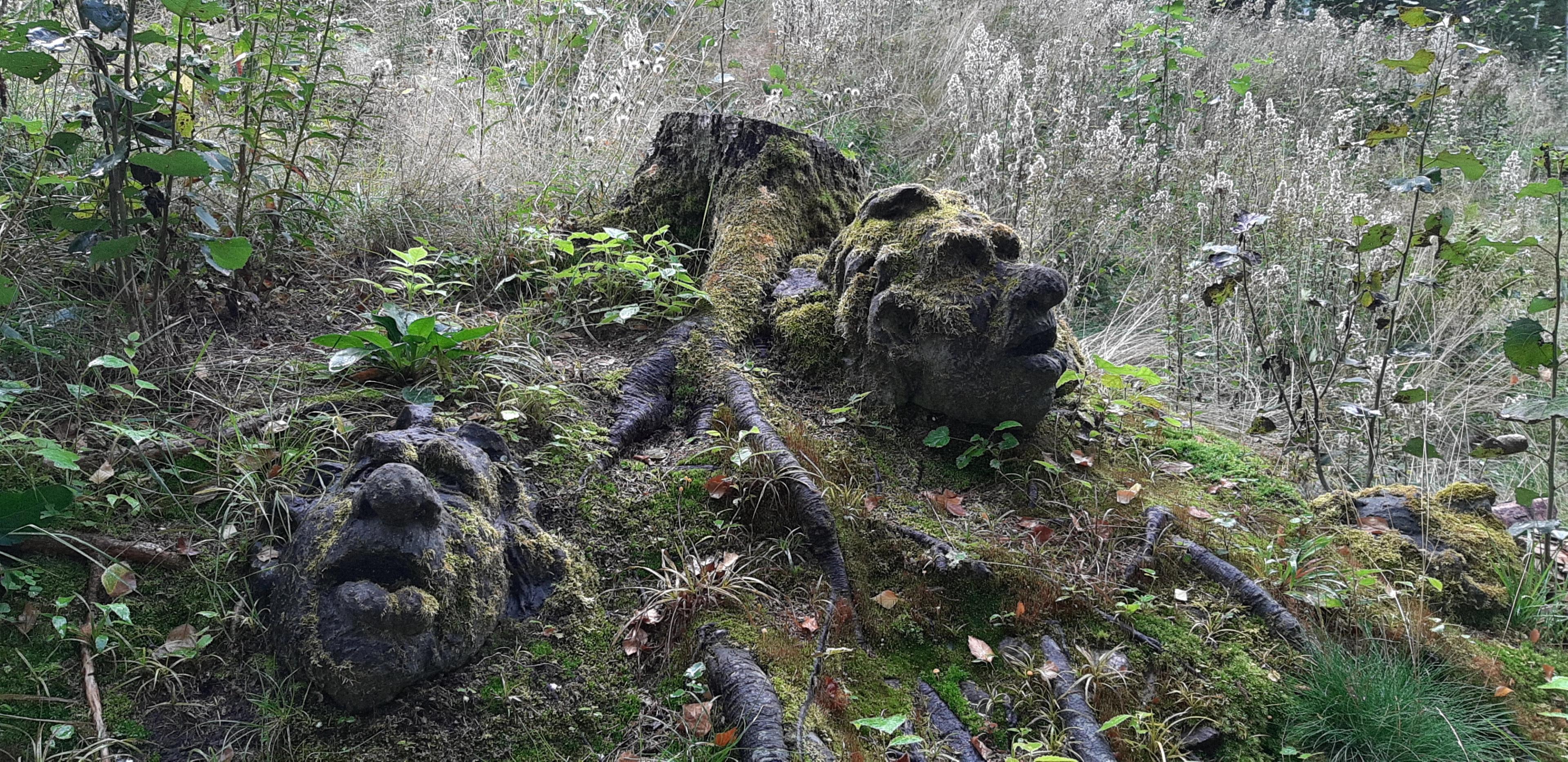 Troll faces carved in wood by Tom Berre