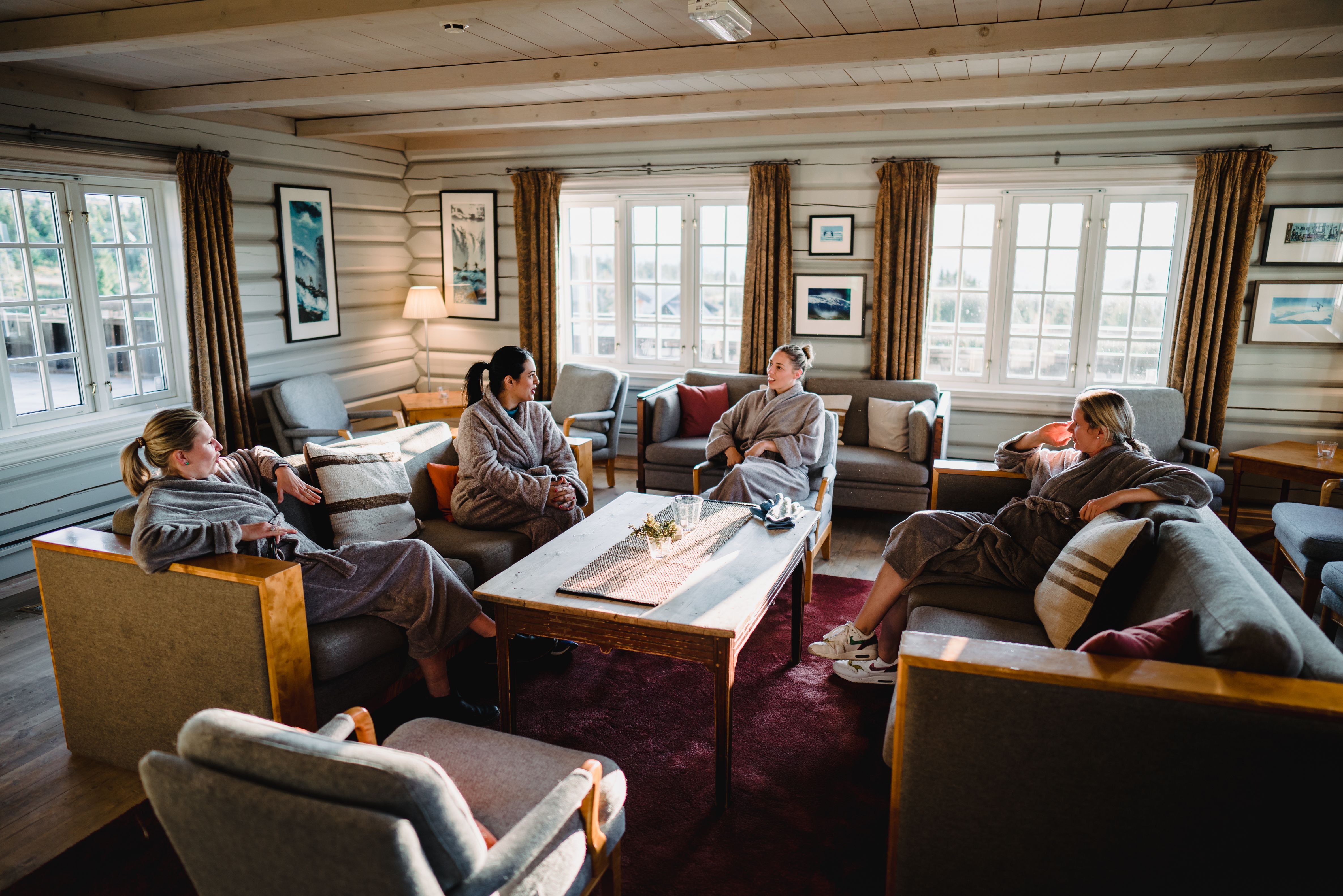 Four women are relaxing in a cabin at Ilsetra in Lillehammer, Eastern Norway