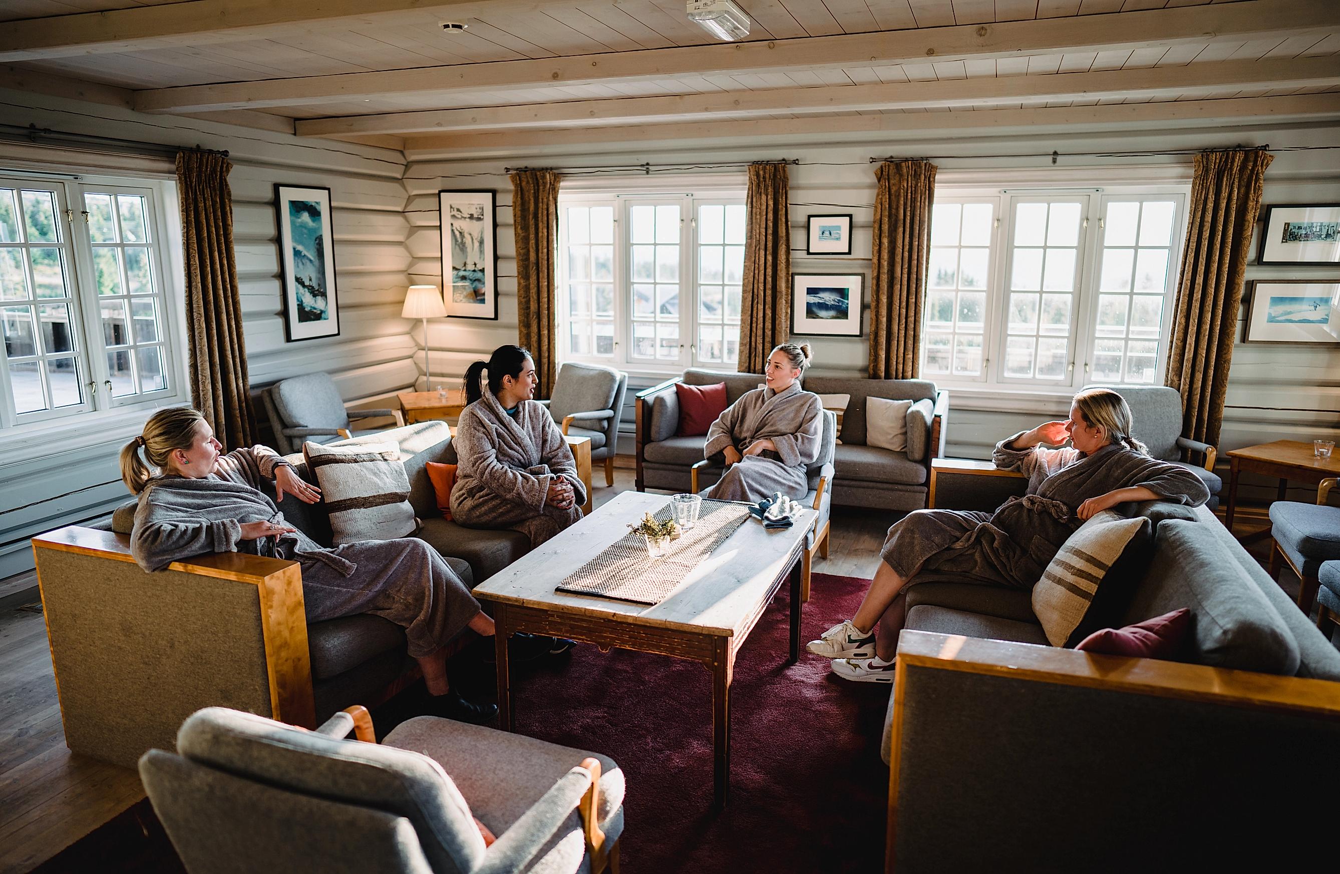 Four women are relaxing in a cabin at Ilsetra in Lillehammer, Eastern Norway