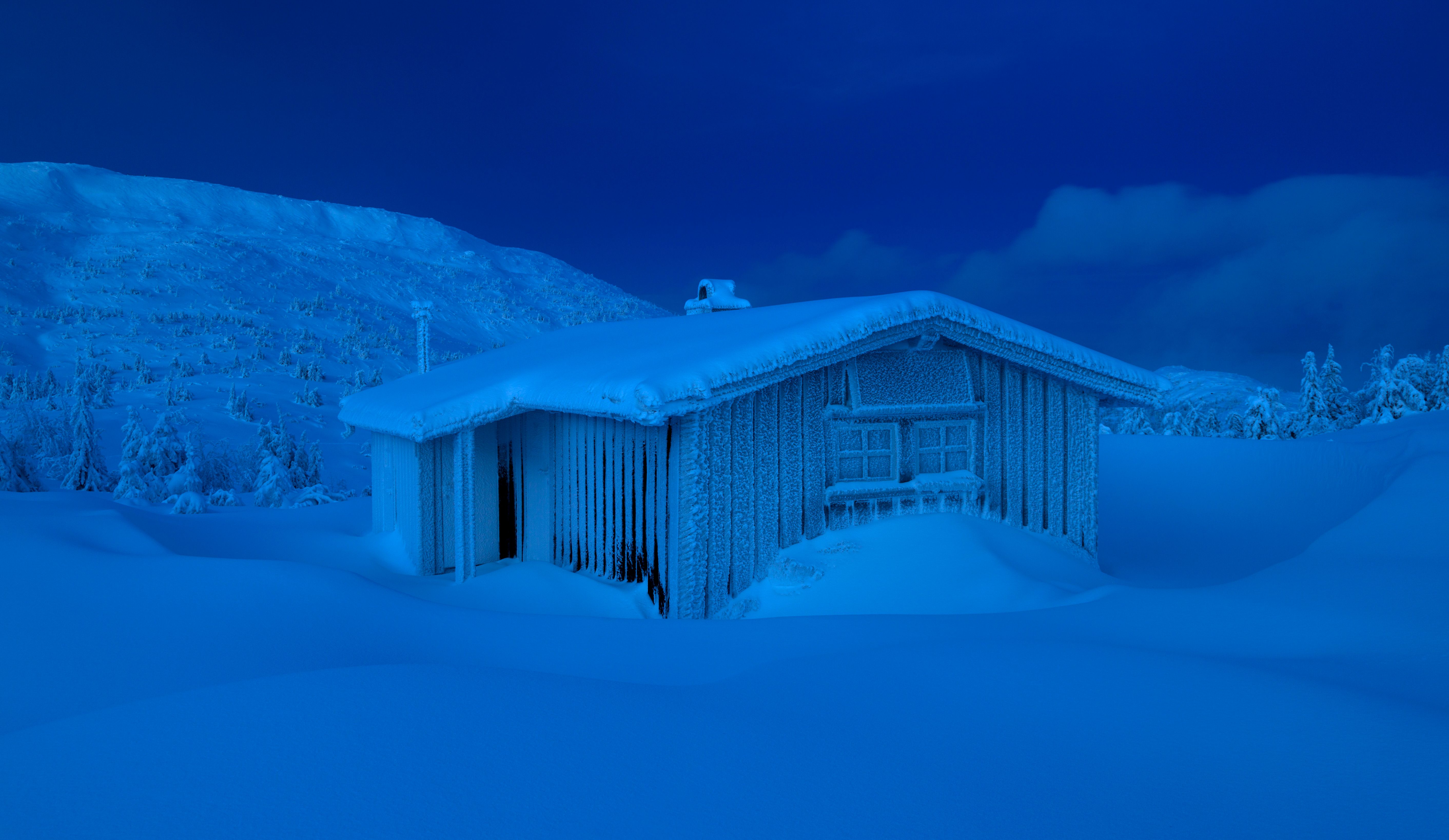 A cabin in the dark in Lifjell, Norway