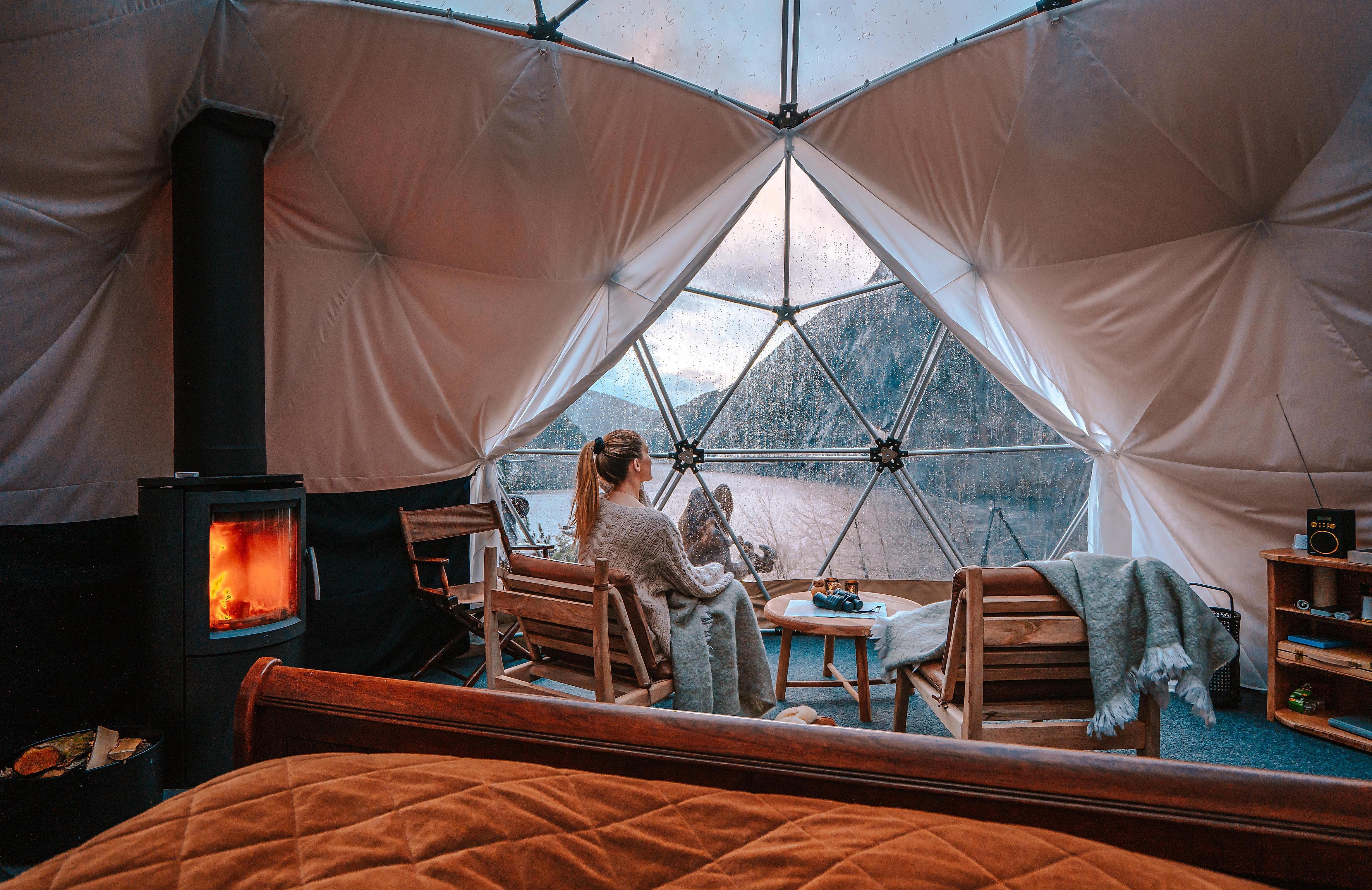 A woman enjoying the view from Åkrafjorden Glamping