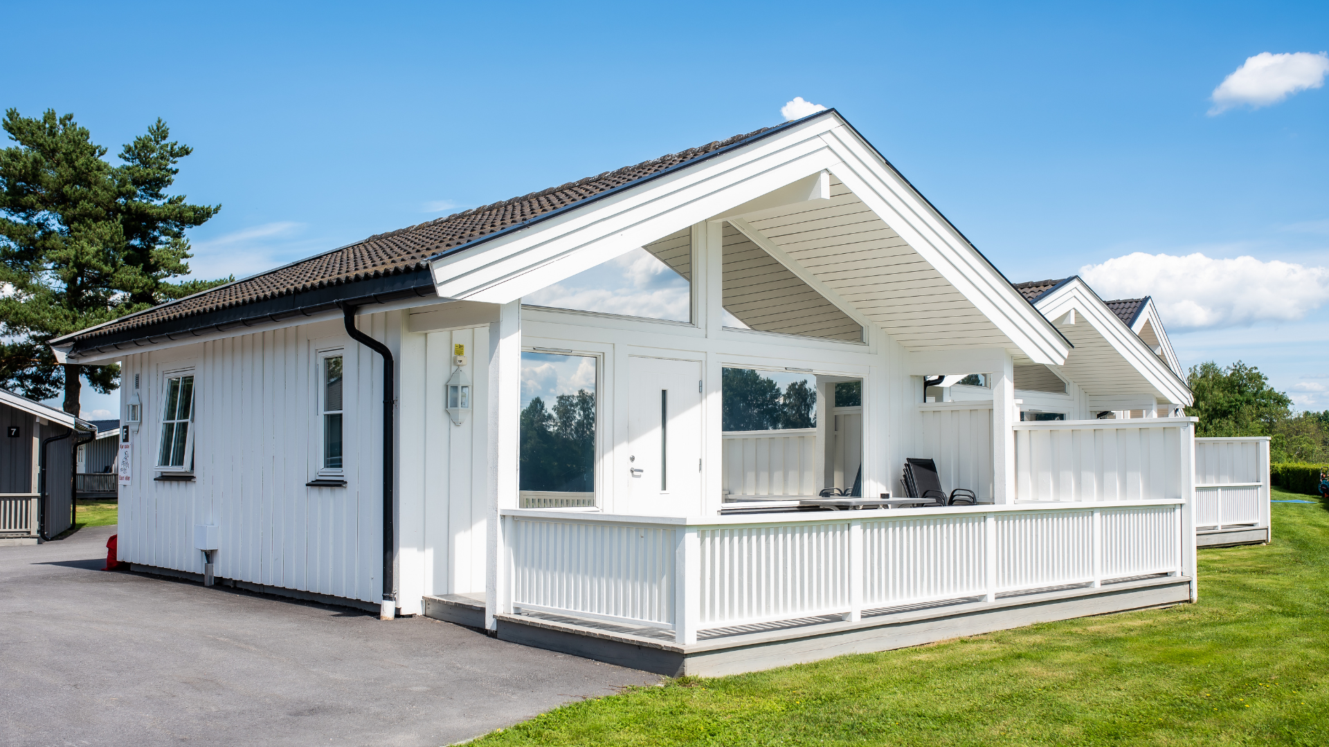 white cabins for rent at Sanngrund Camping