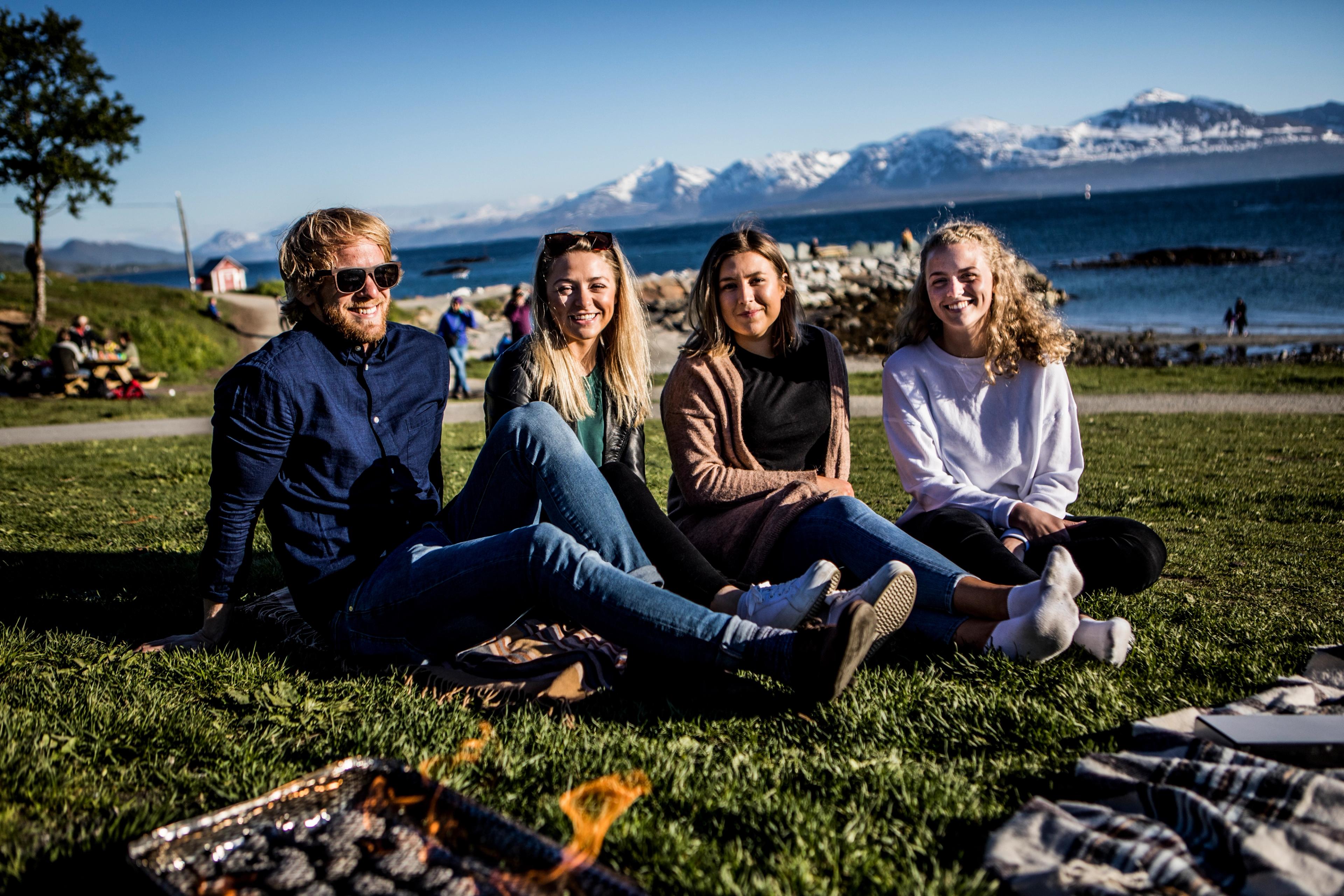 A group of friends is barbecuing at the Telegrafbukta bay in Tromsø, Northern Norway