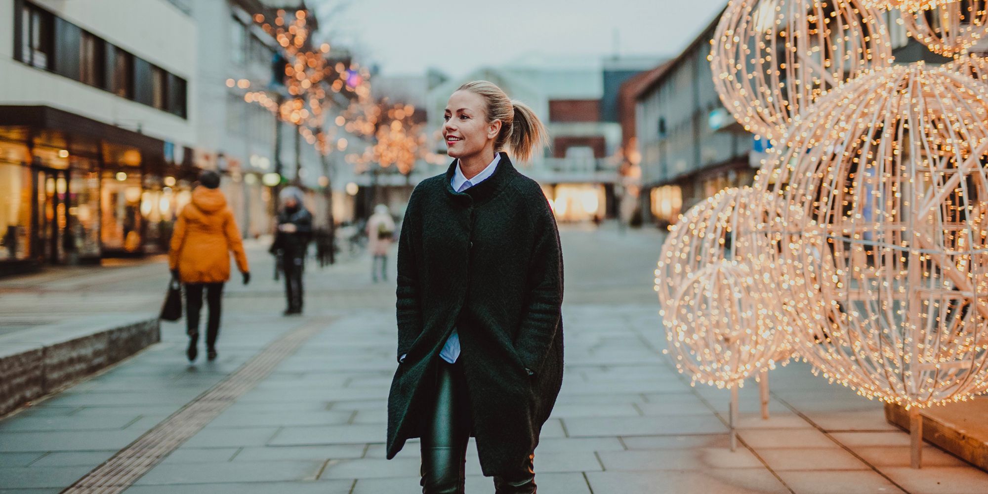 Veronica Kåring walking Christmas street, Bodø, Northern Norway