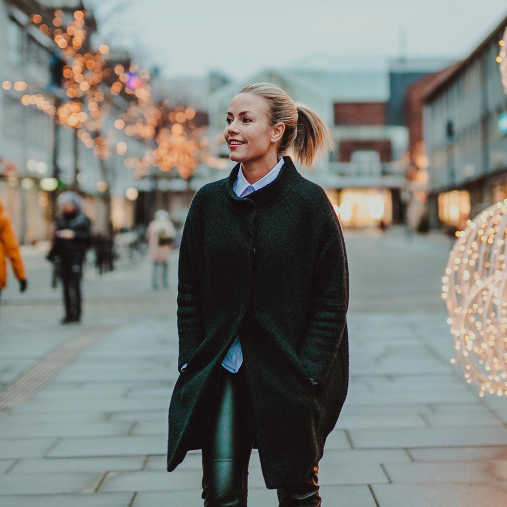 Veronica Kåring walking Christmas street, Bodø, Northern Norway