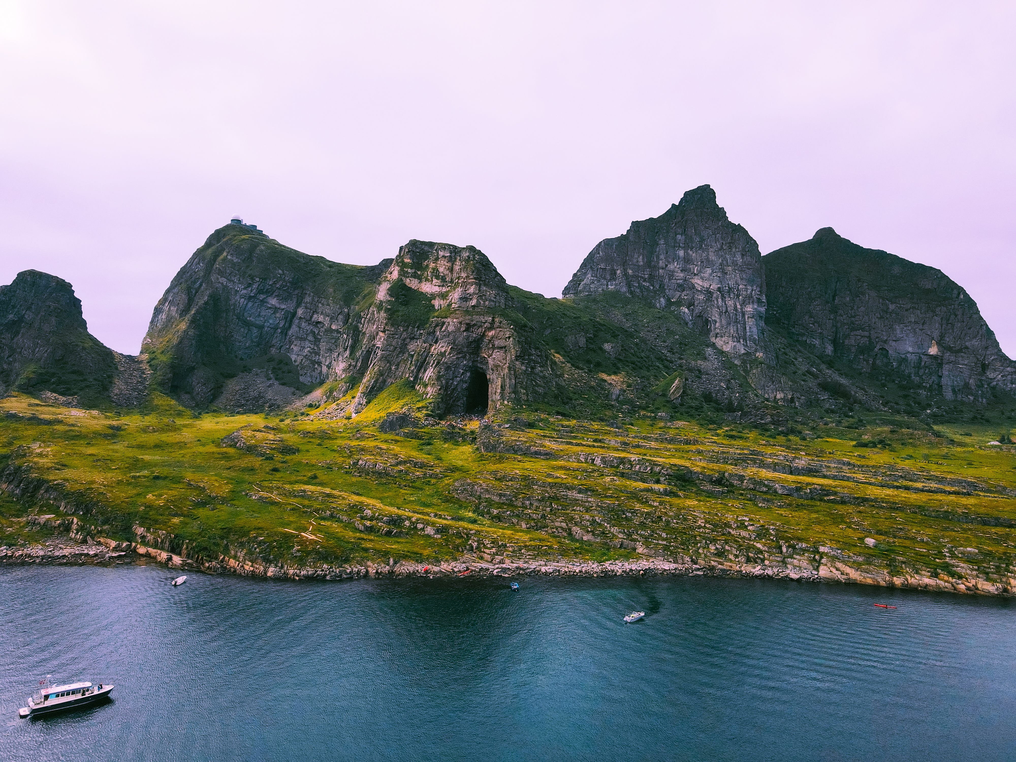 The cave Kirkhellaren in Træna Helgeland seen from the sea, Northern Norway