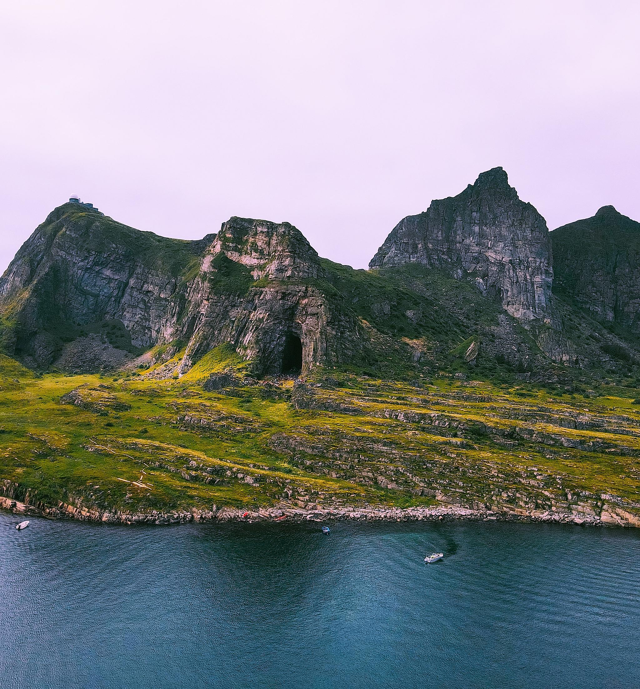 The cave Kirkhellaren in Træna Helgeland seen from the sea, Northern Norway
