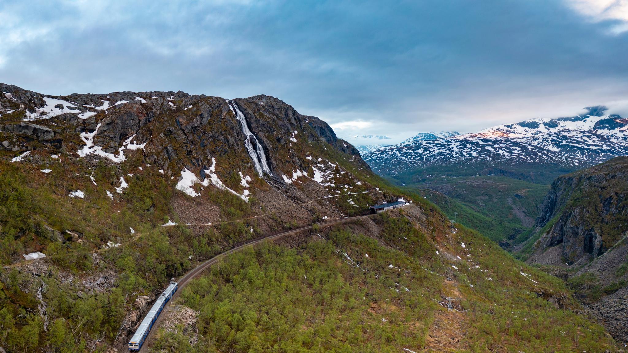 A train on a mountainside in Norway