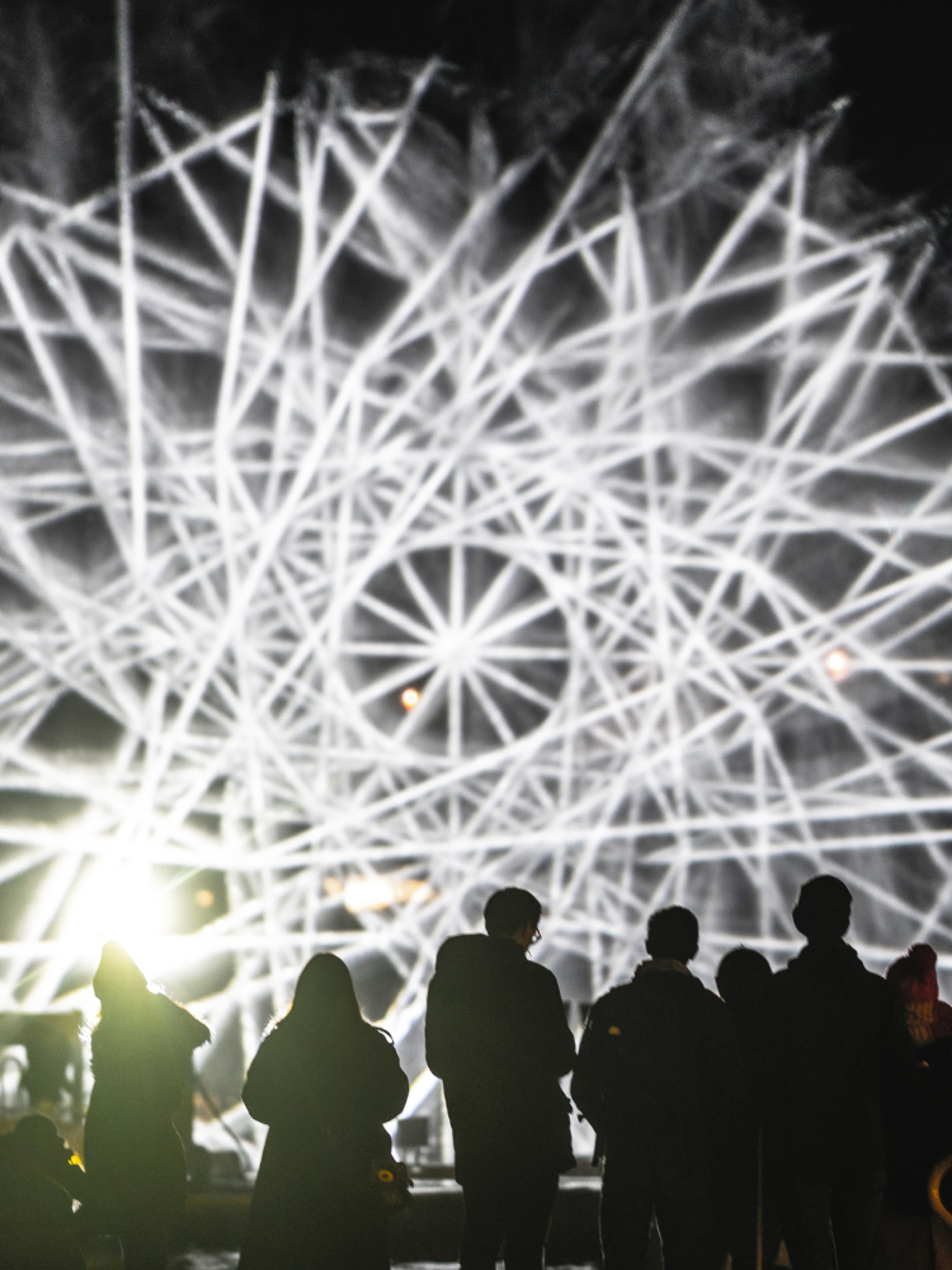People watching light art at Fjord Oslo light art festival