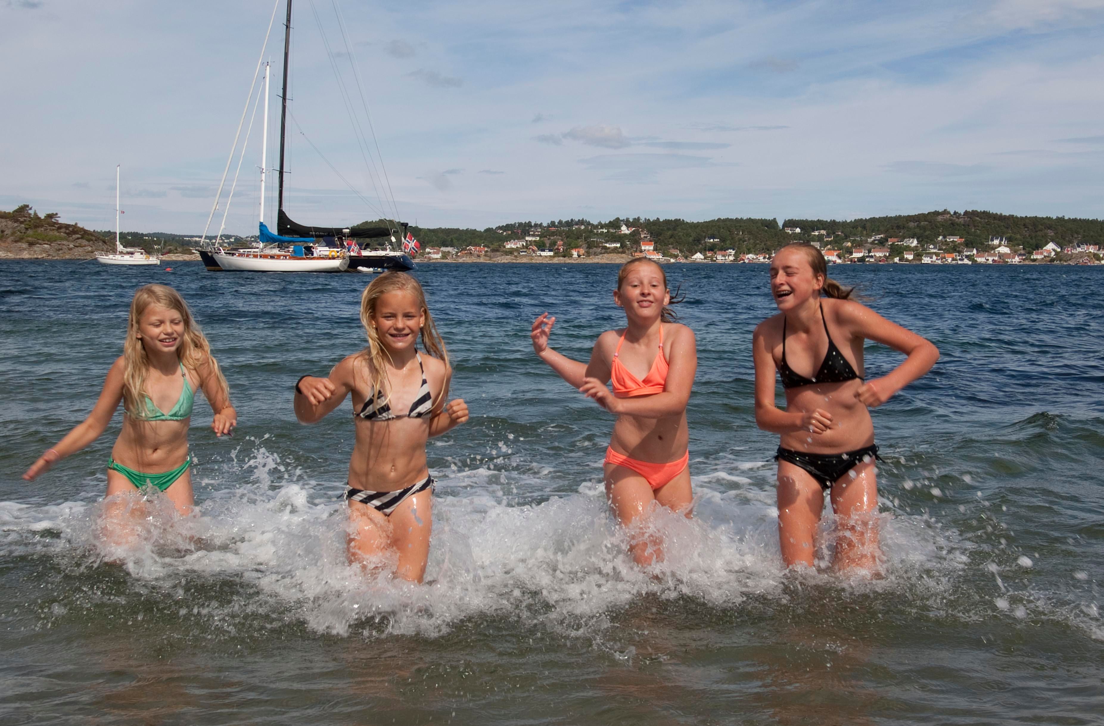 Children playing at the beach at Merdø island