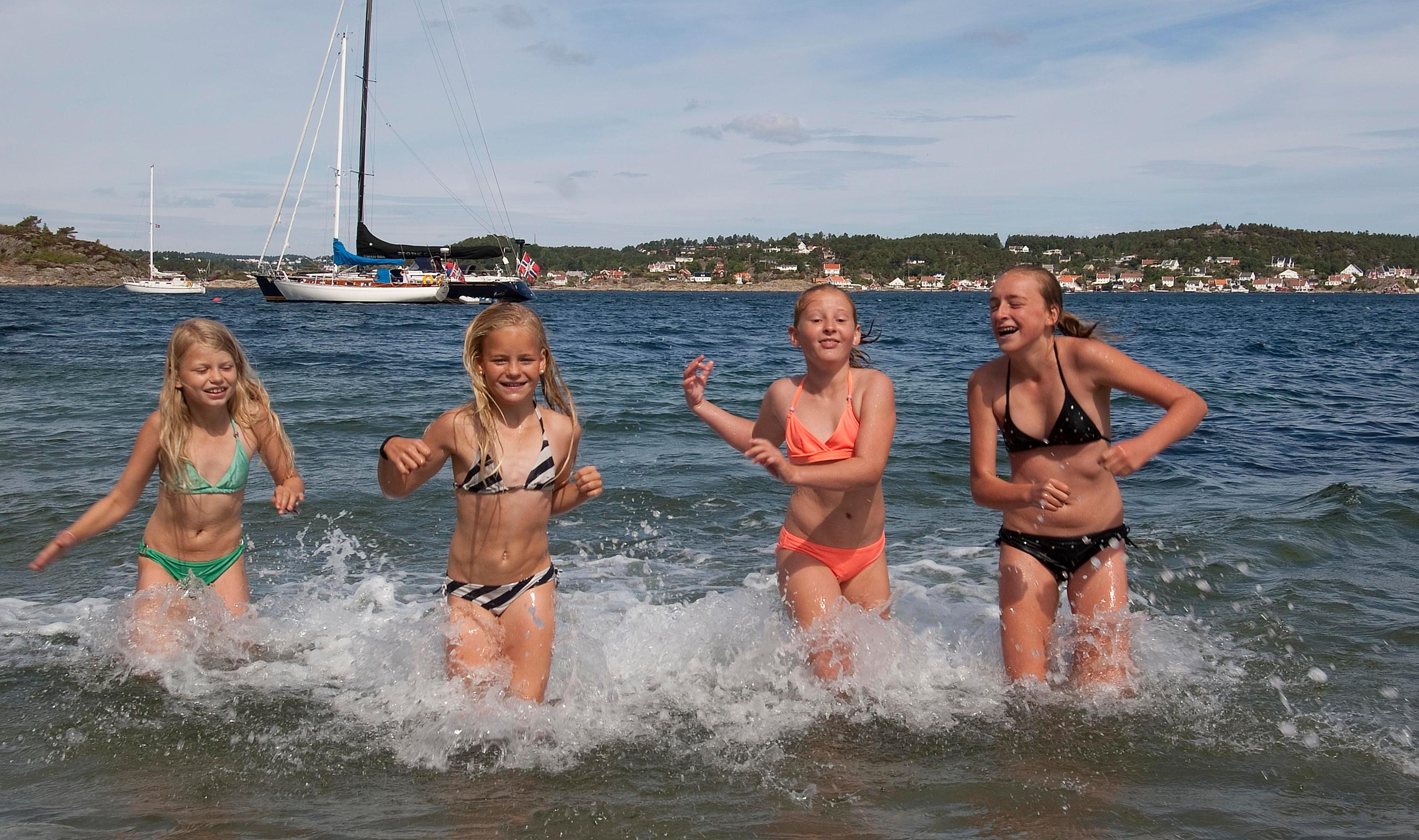 Children playing at the beach at Merdø island