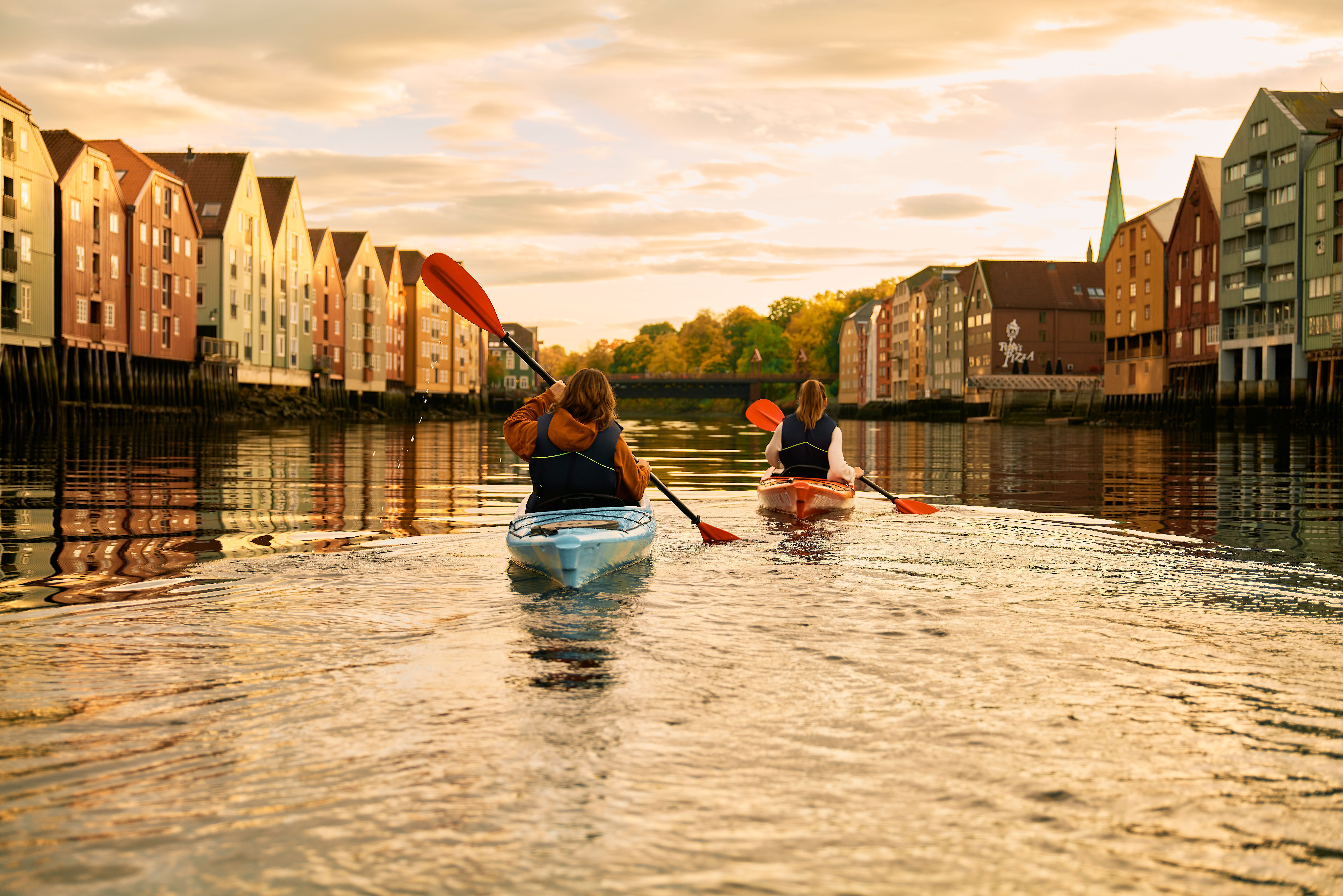 Kayaking in the sunset in the Nidelva river in Trondheim, Trøndelag