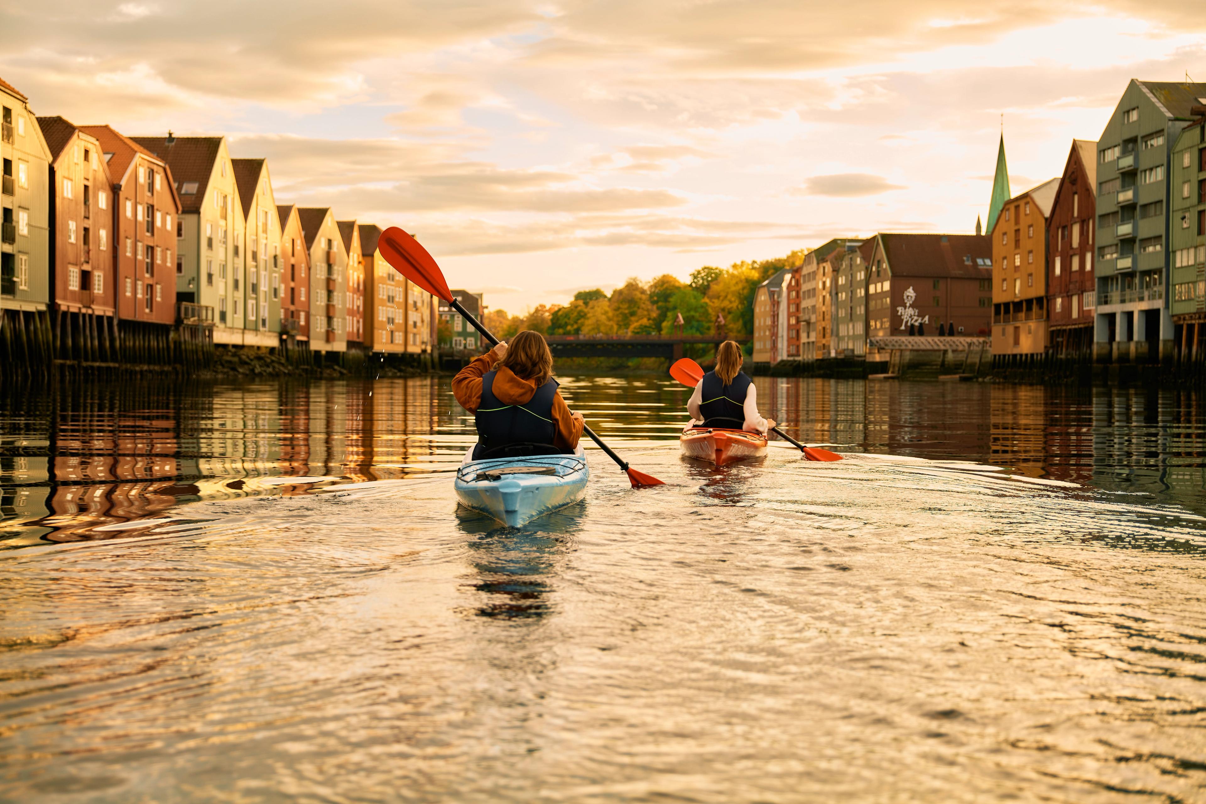Kayaking in the sunset in the Nidelva river in Trondheim, Trøndelag