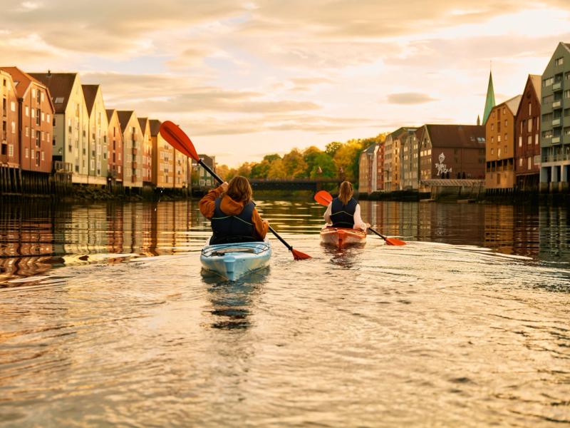 Kayaking in the sunset in the Nidelva river in Trondheim, Trøndelag