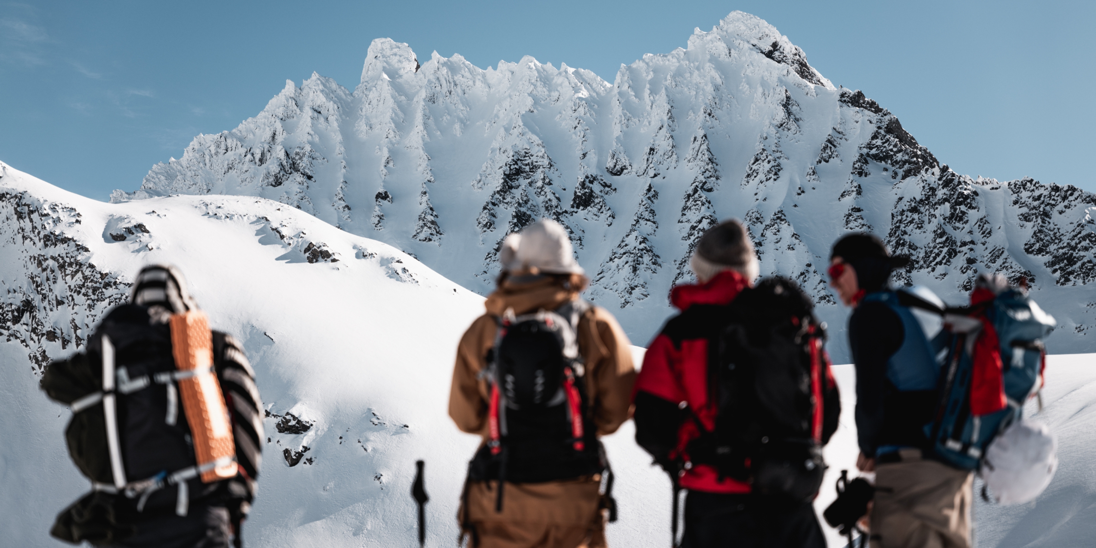 A group of people ski touring to Smørskredtindane in Ørsta and Stranda at Sunnmøre in Fjord Norway