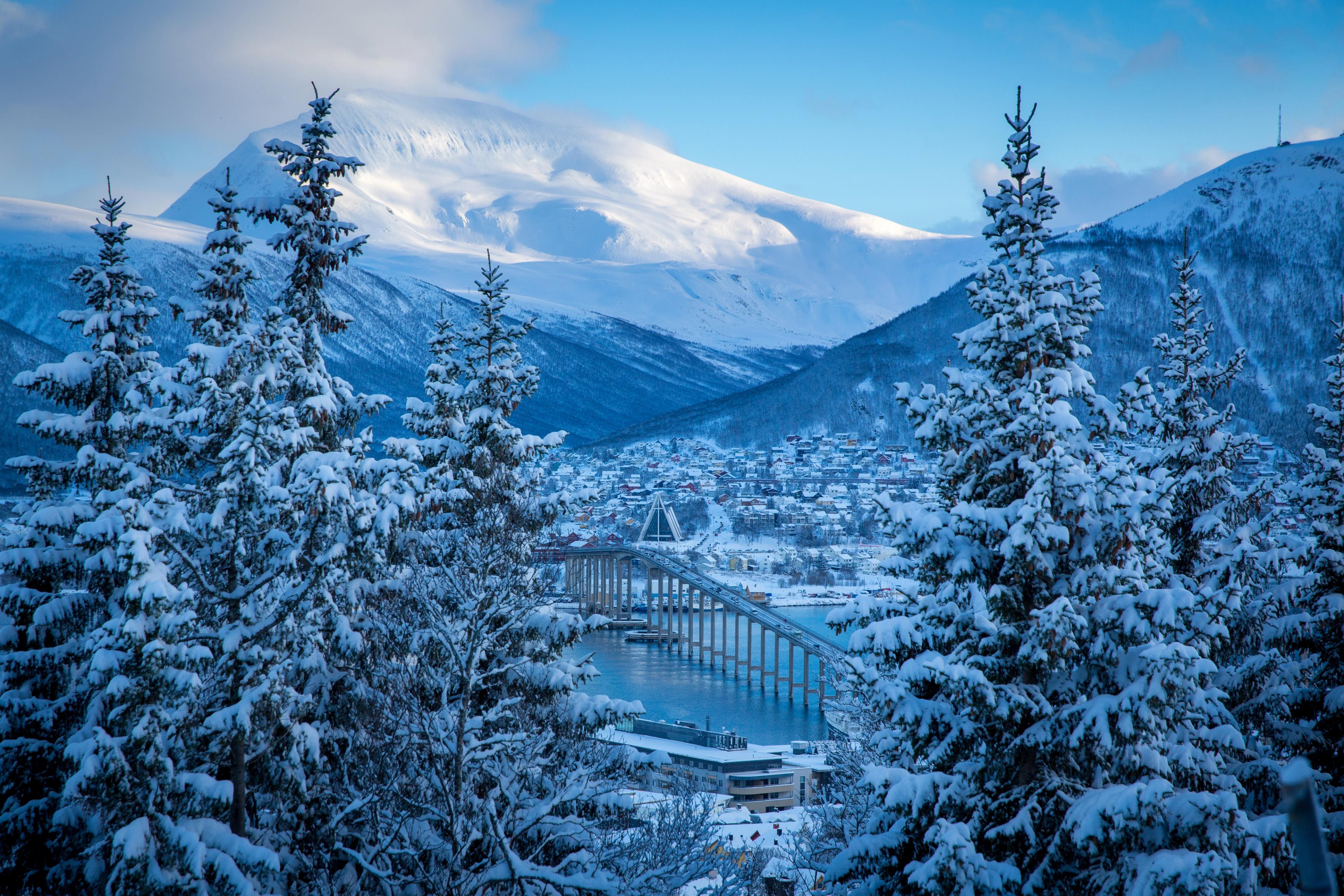 The Arctic Cathedral and the bridge in Tromsø covered in snow