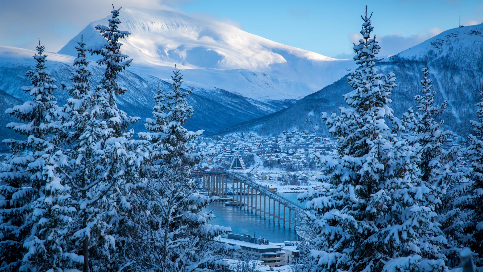 The Arctic Cathedral and the bridge in Tromsø covered in snow