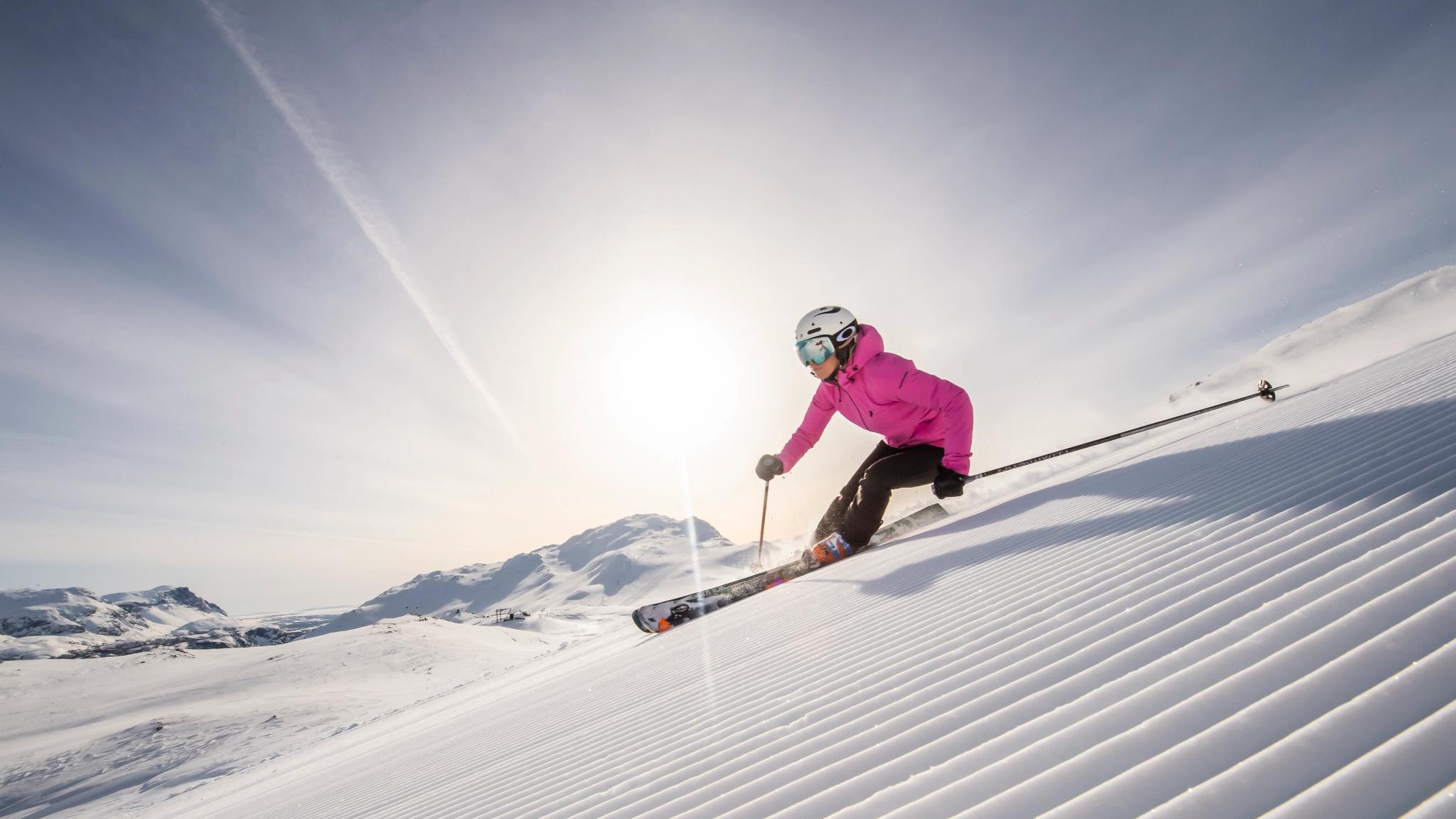 A woman skiing down an alpine slope in Hemsedal in Eastern Norway