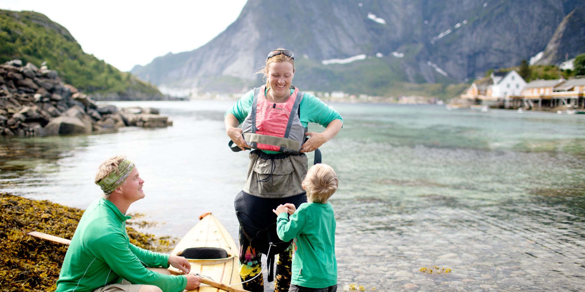 A family with a kayak in Lofoten, Northern Norway