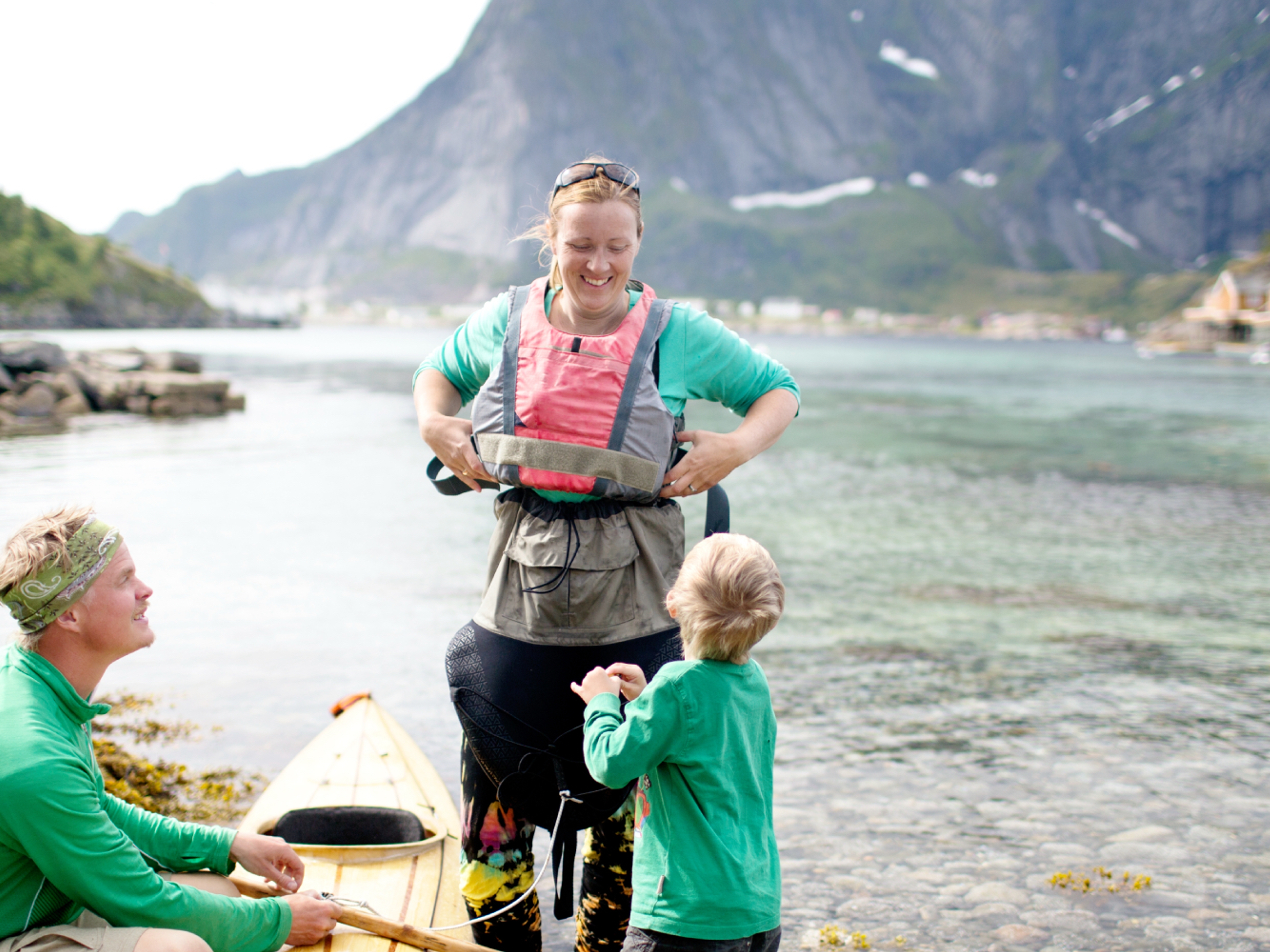A family with a kayak in Lofoten, Northern Norway