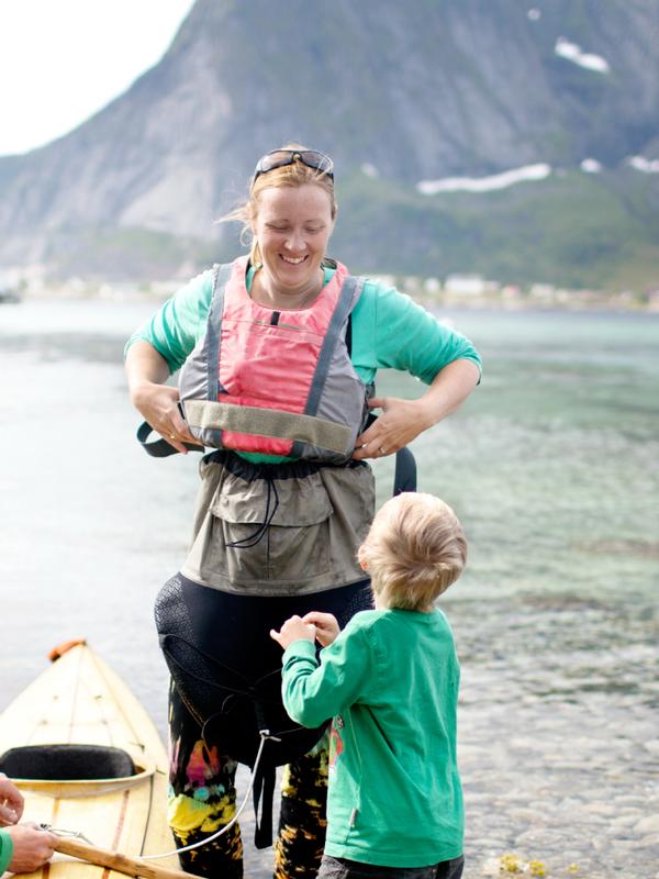 A family with a kayak in Lofoten, Northern Norway