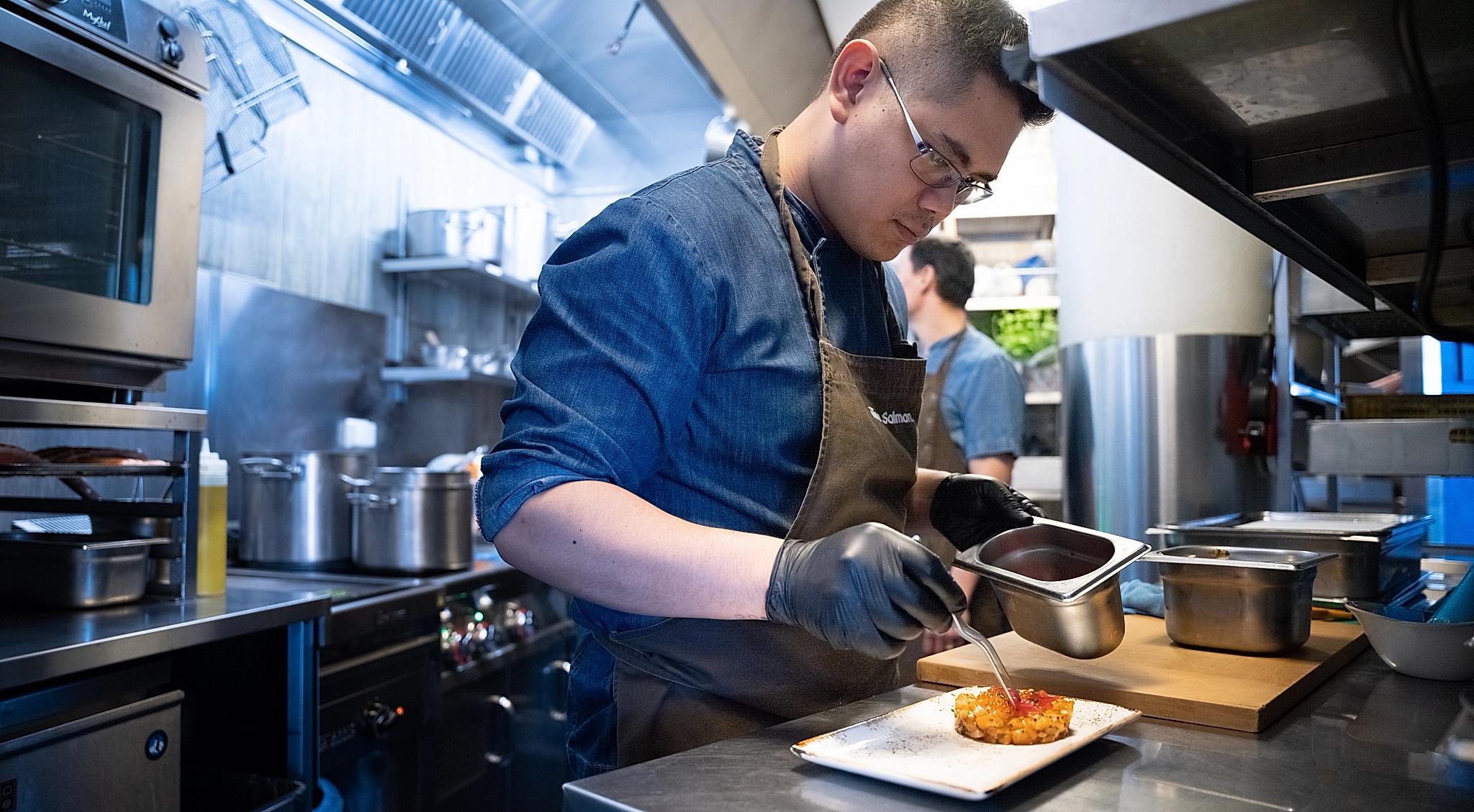 Chef Harry Hermosa making salmon tartar at The Salmon, Tjuvholmen in Oslo