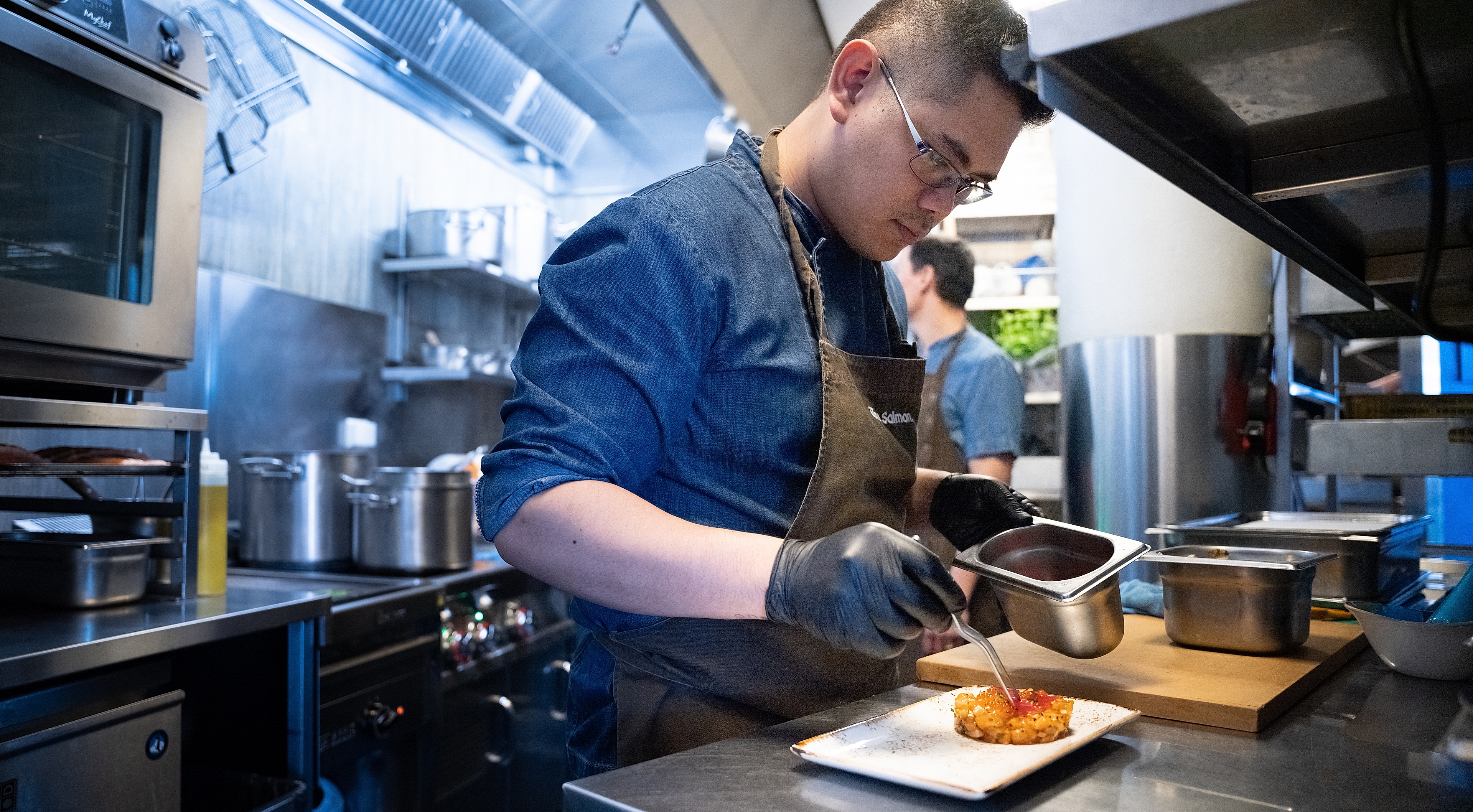 Chef Harry Hermosa making salmon tartar at The Salmon, Tjuvholmen in Oslo