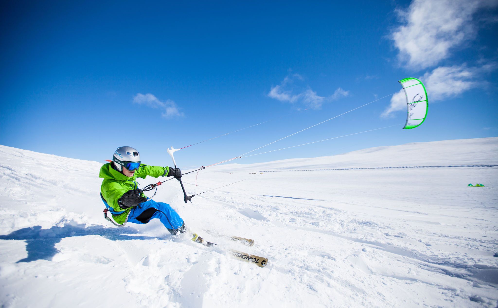 A man snowkiting on the Valdresflye mountain plateau in Jotunheimen, Eastern Norway