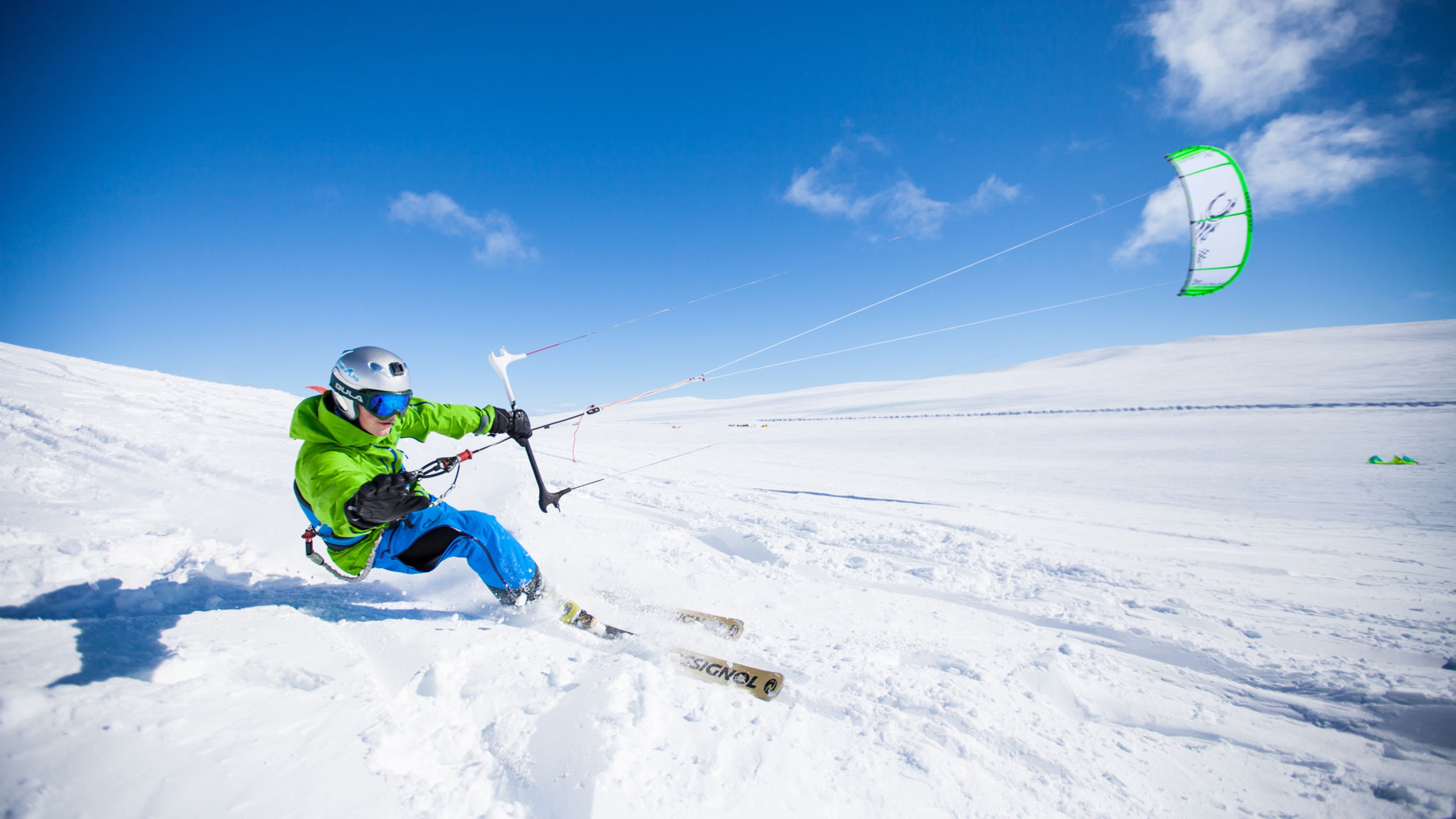 A man snowkiting on the Valdresflye mountain plateau in Jotunheimen, Eastern Norway