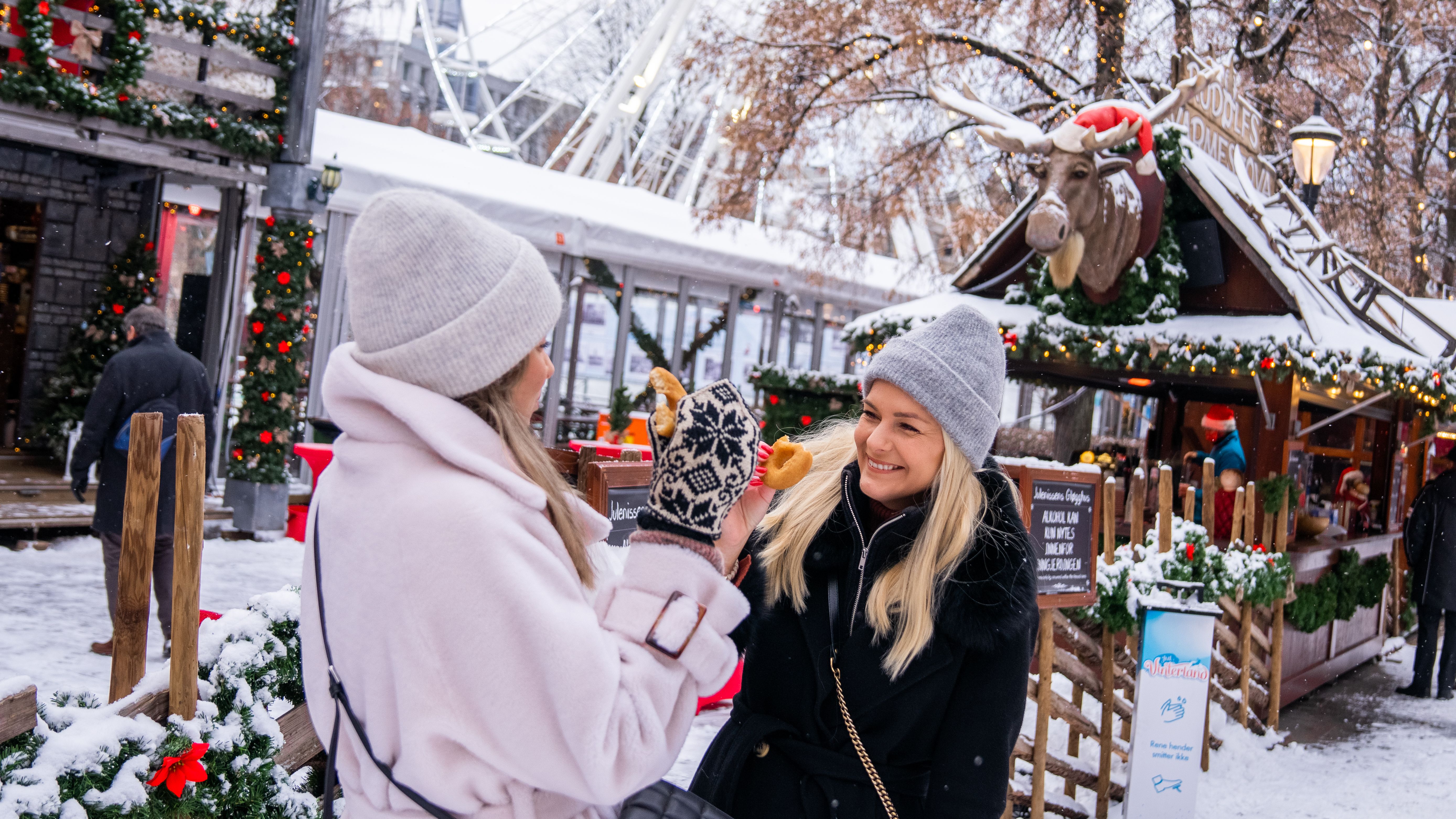 Two women at the Christmas market in Oslo, Eastern Norway