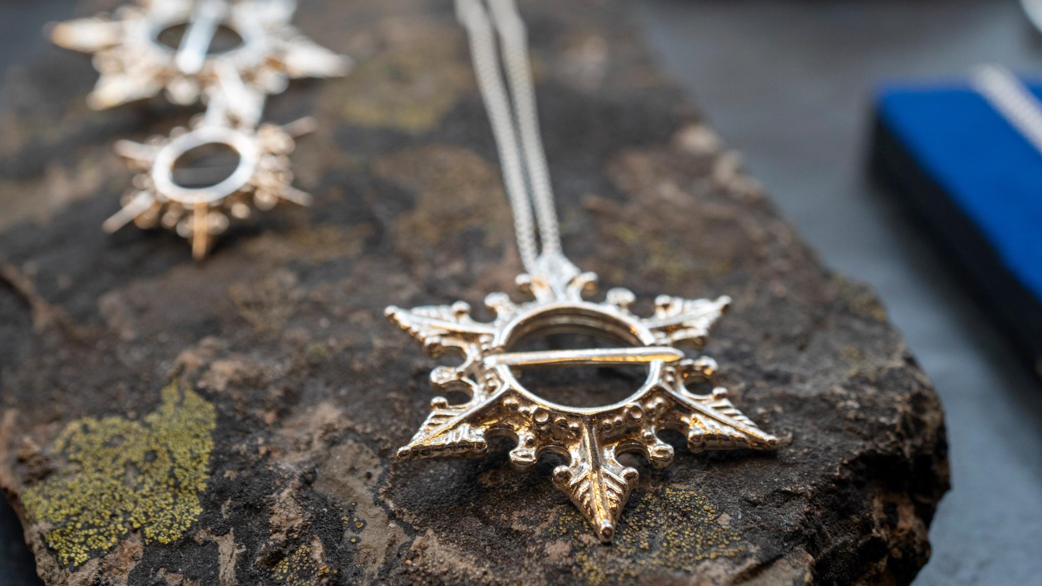 Silver necklaces on a rock in Juhls Silver Gallery