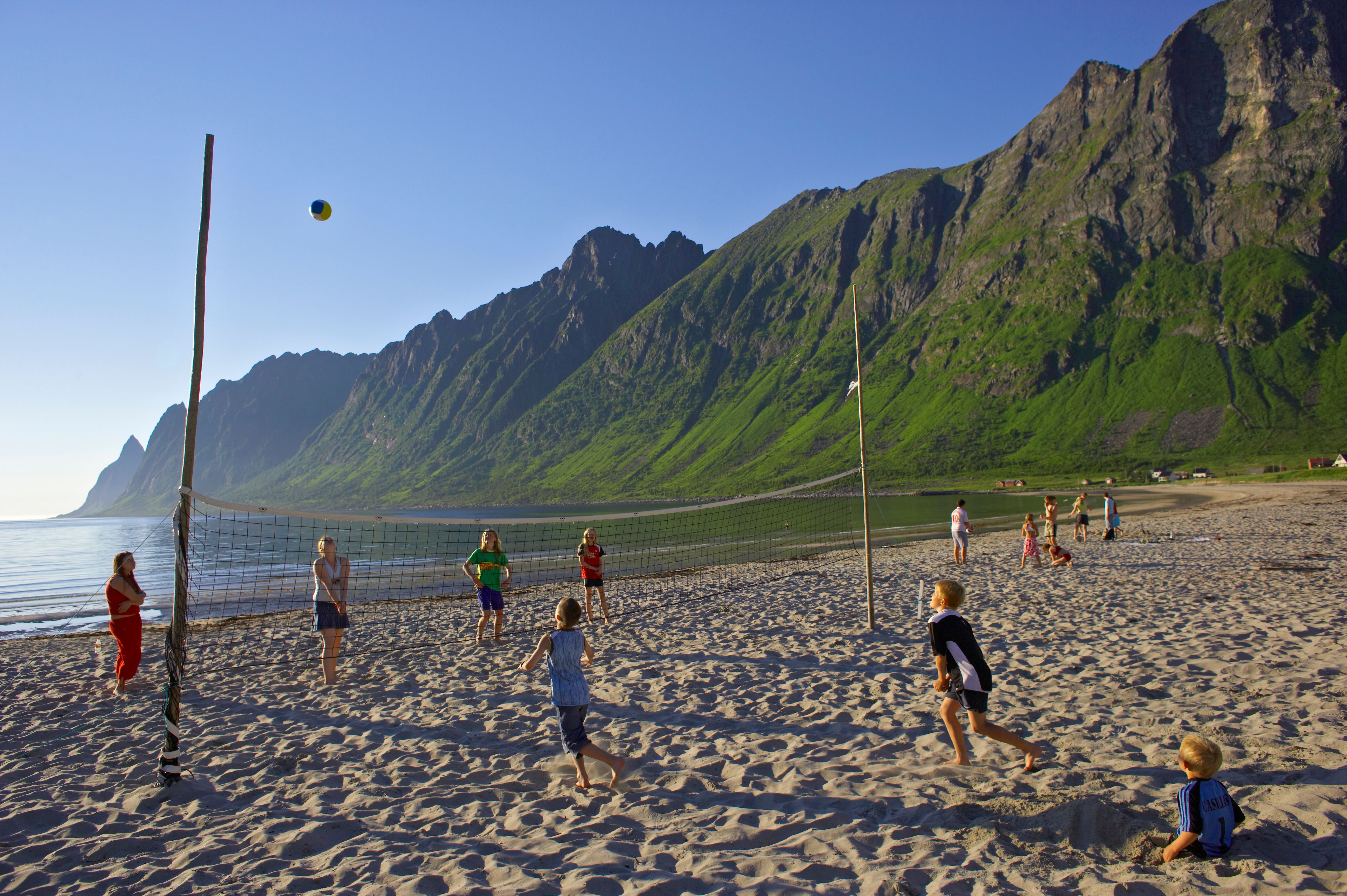 Kids playing beachvolleyball at Ersfjordstranda in Senja