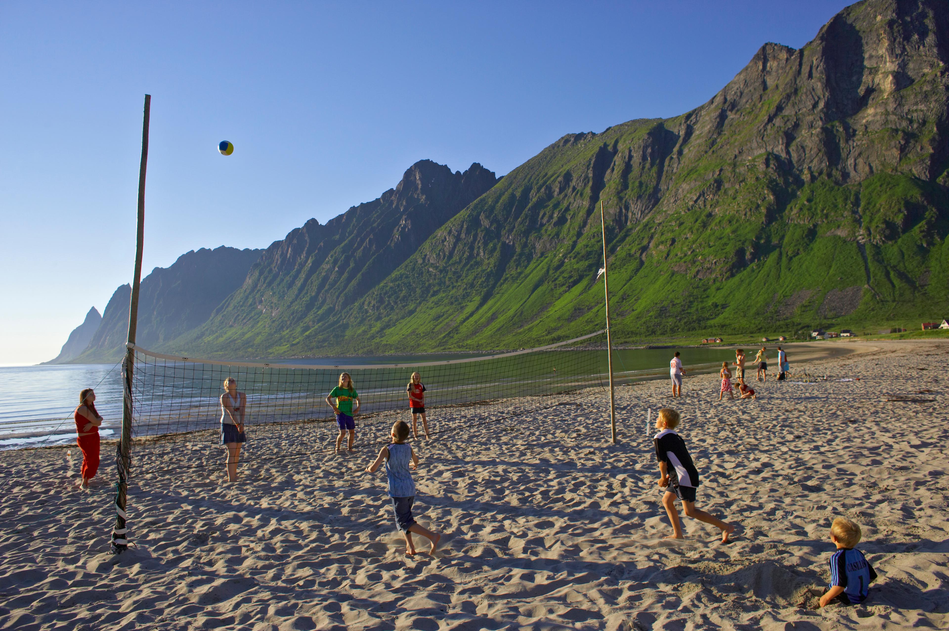 Kids playing beachvolleyball at Ersfjordstranda in Senja