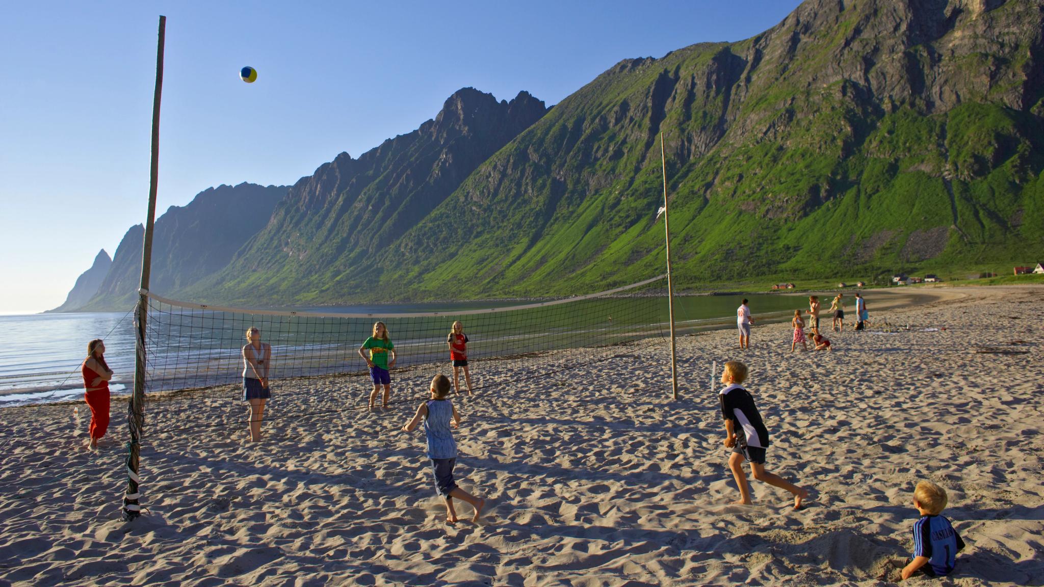 Kids playing beachvolleyball at Ersfjordstranda in Senja