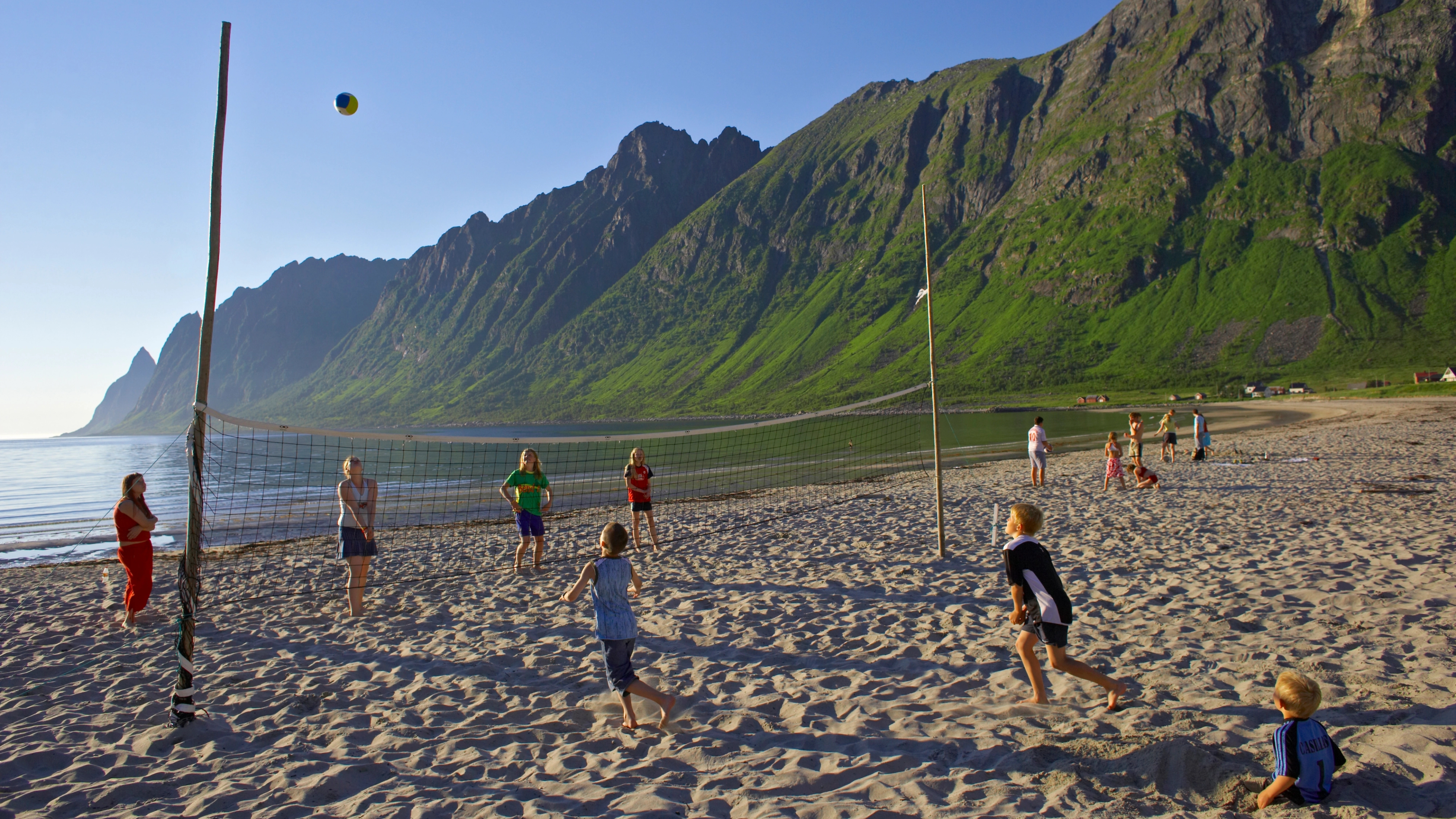 Kids playing beachvolleyball at Ersfjordstranda in Senja