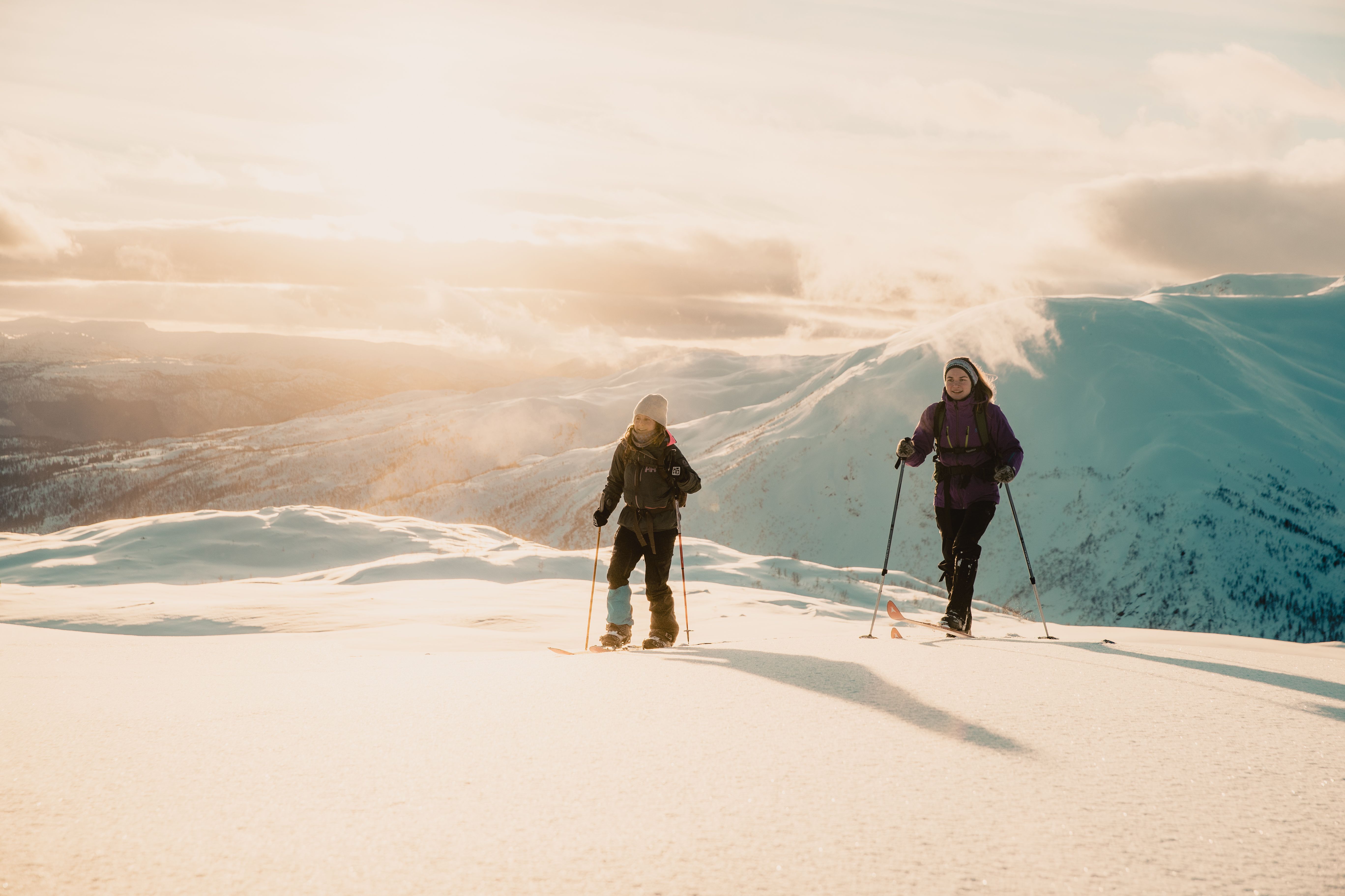 Two girls cross-country skiing at the ski resort Hodlekve in Sogndal, Fjord Norway