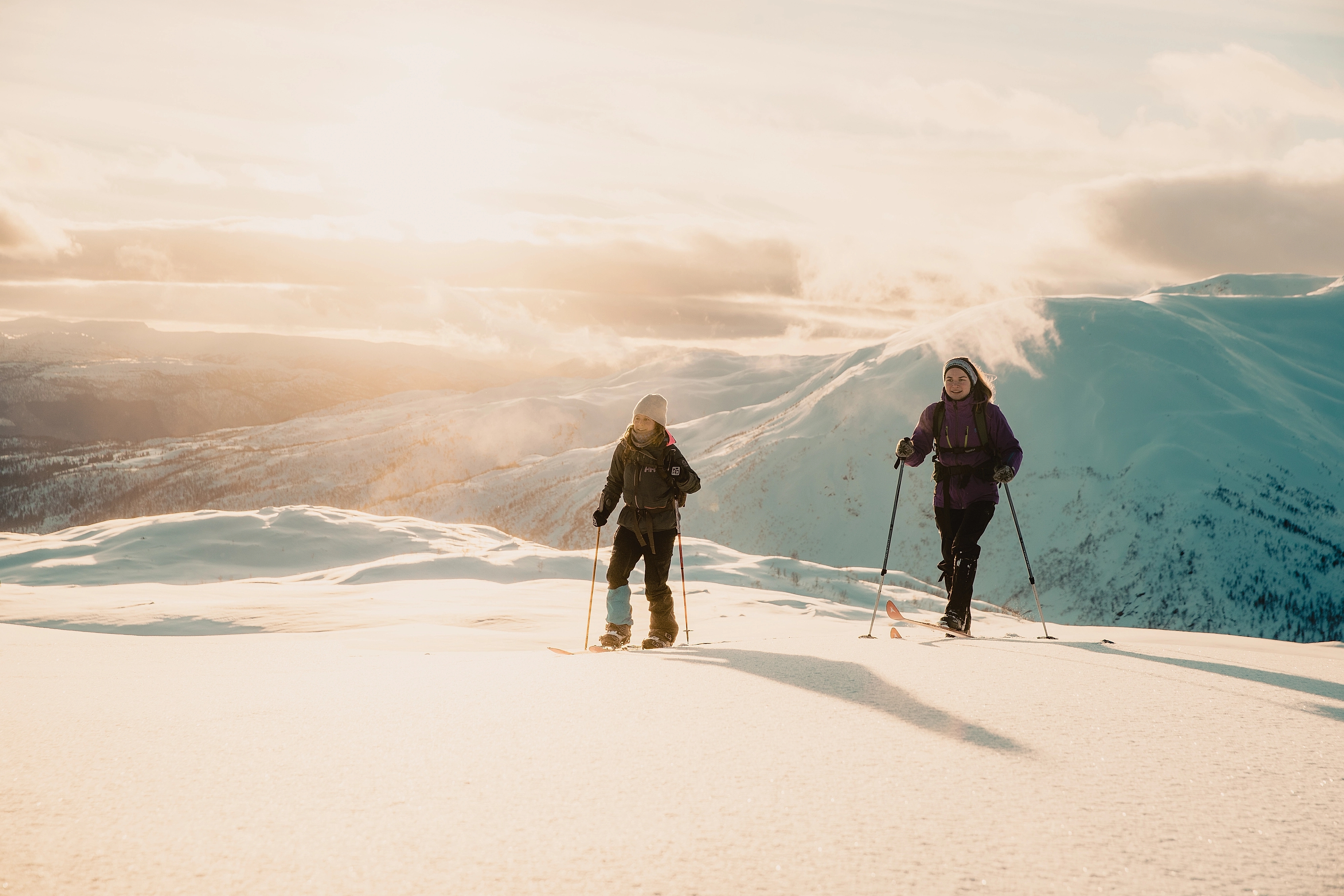 Two girls cross-country skiing at the ski resort Hodlekve in Sogndal, Fjord Norway