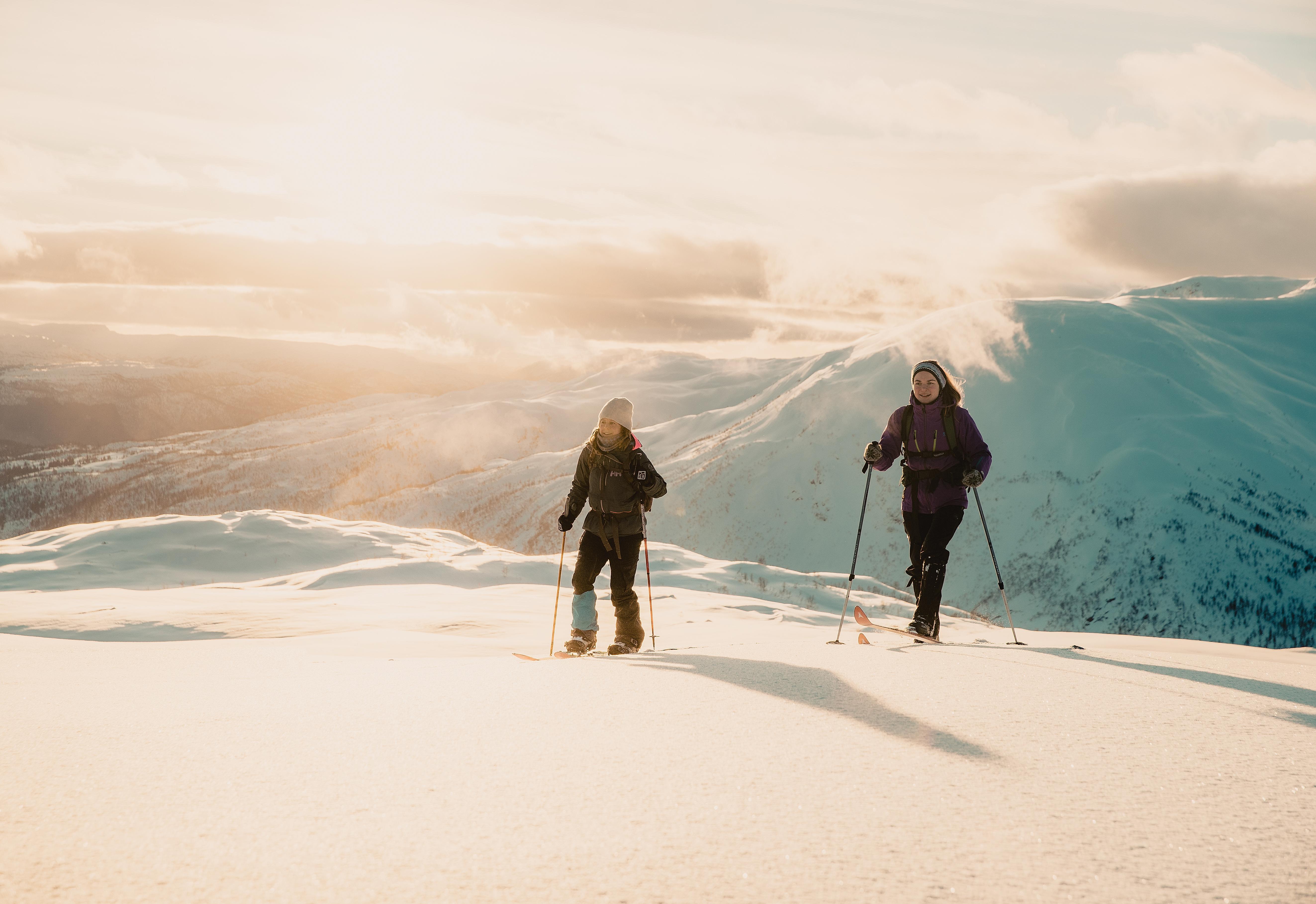 Two girls cross-country skiing at the ski resort Hodlekve in Sogndal, Fjord Norway