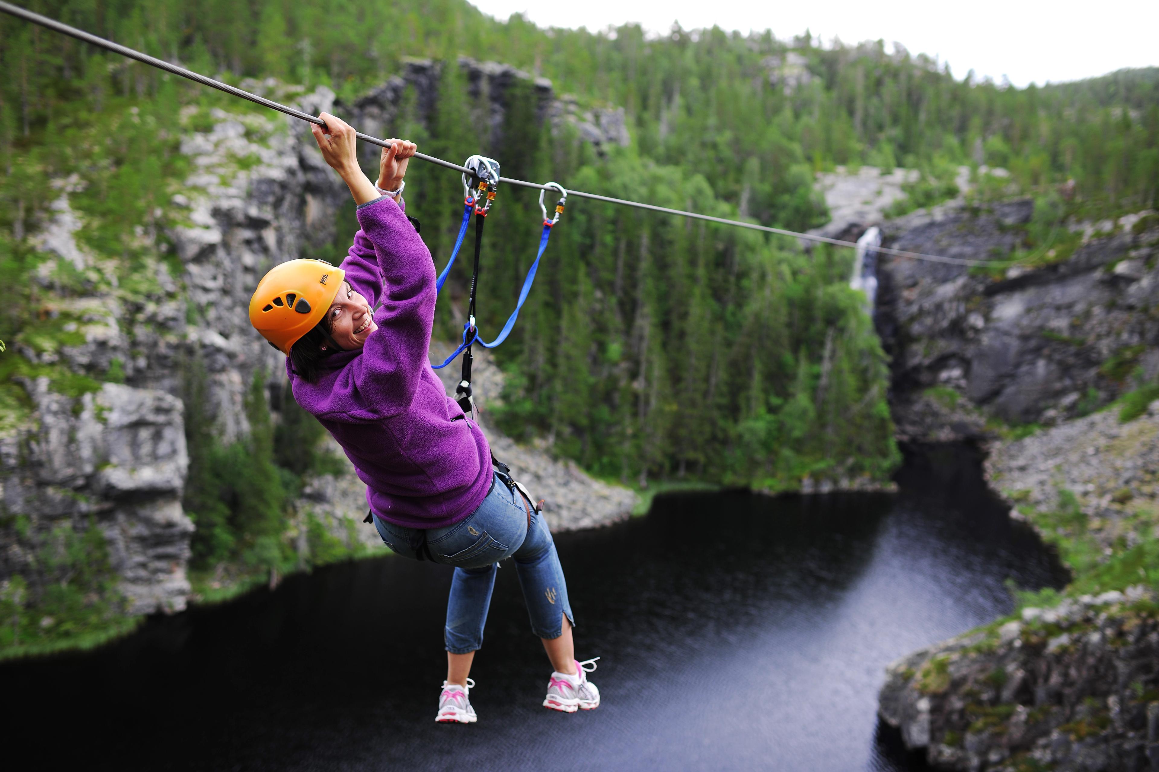 Woman ziplining in Rypetoppen Adventurepark