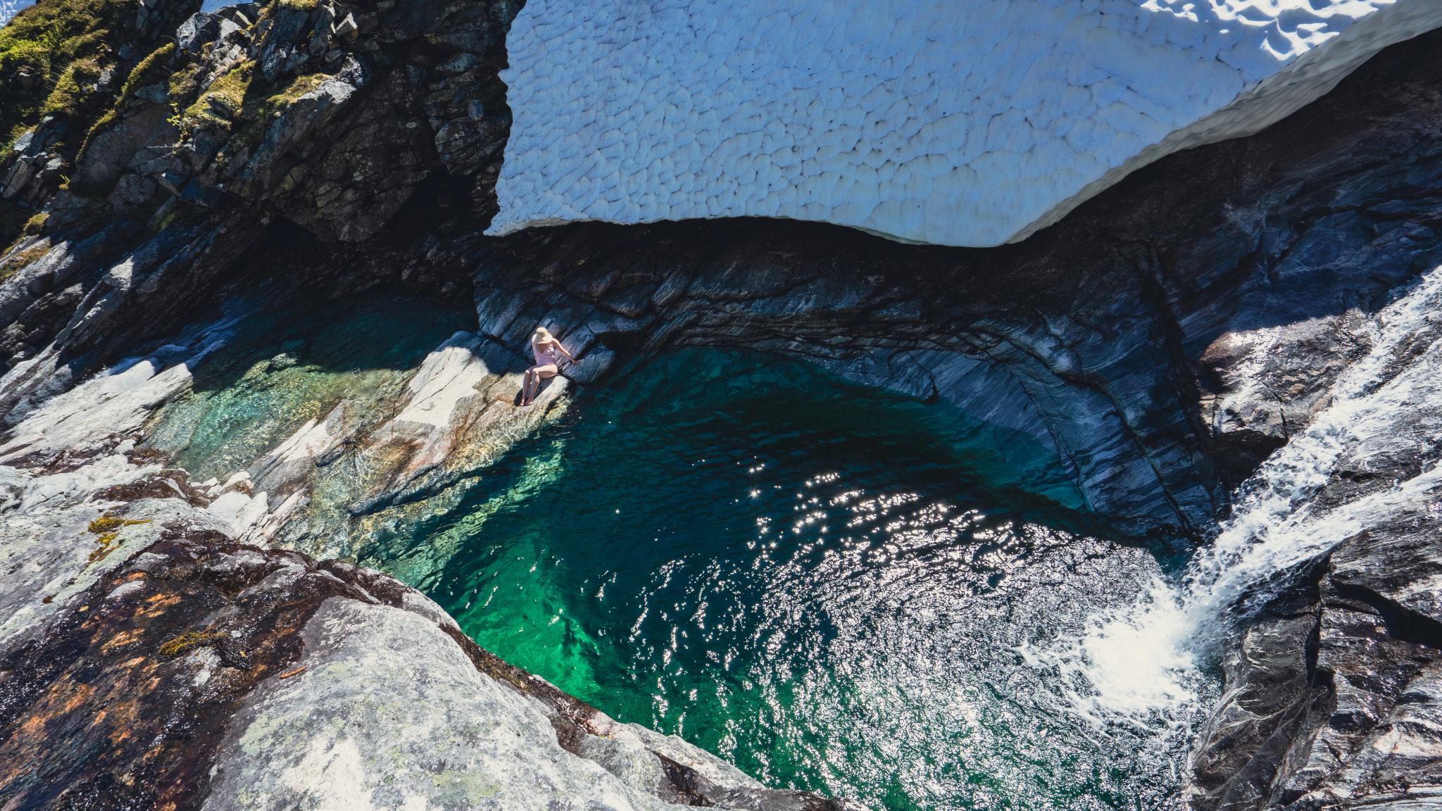 Woman ready for a swim in a pothole in Finnsetlia, Aursjøvegen
