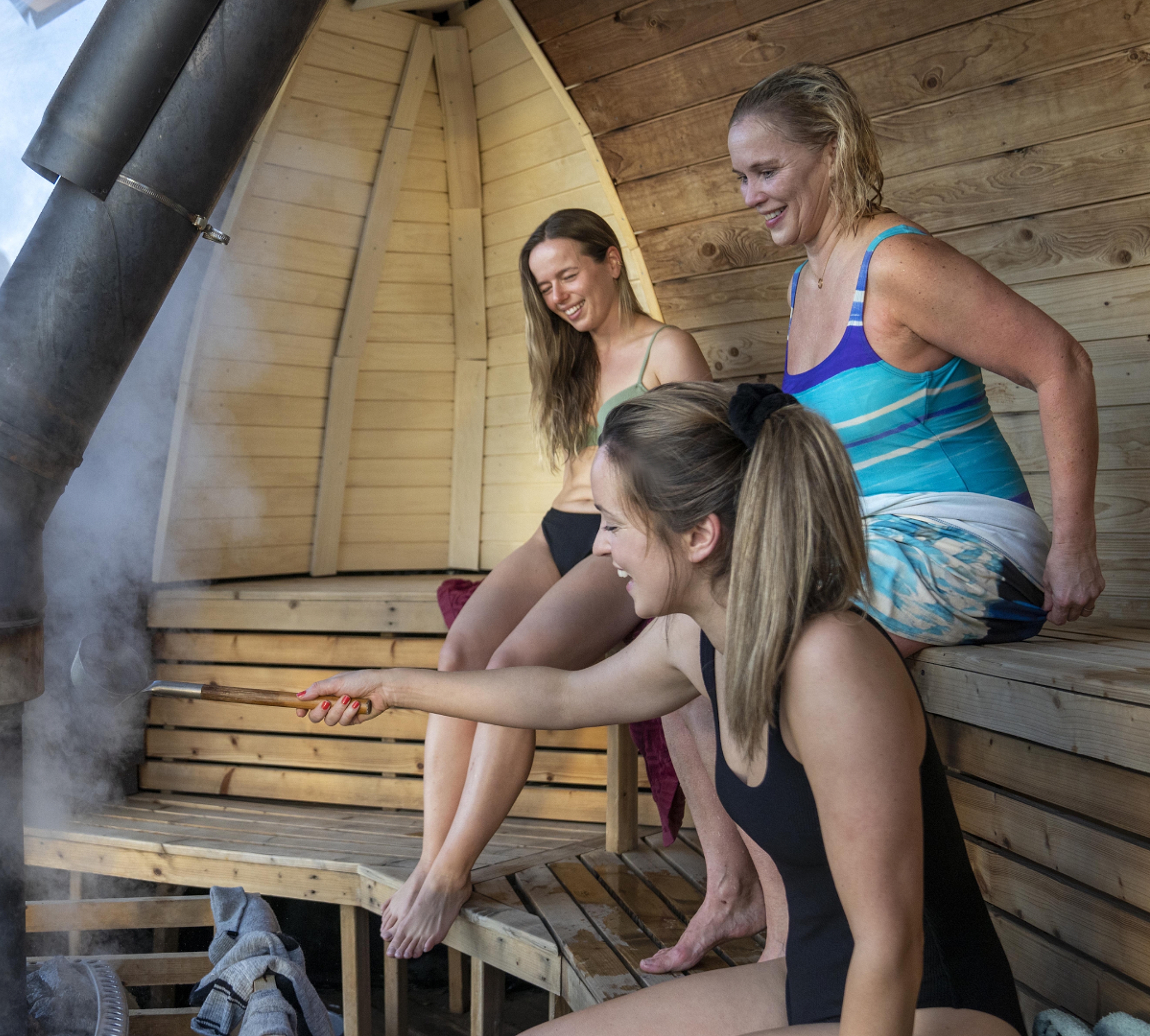 Friends sitting in Sauna at Oslo Badstuforening in Oslo, Eastern Norway