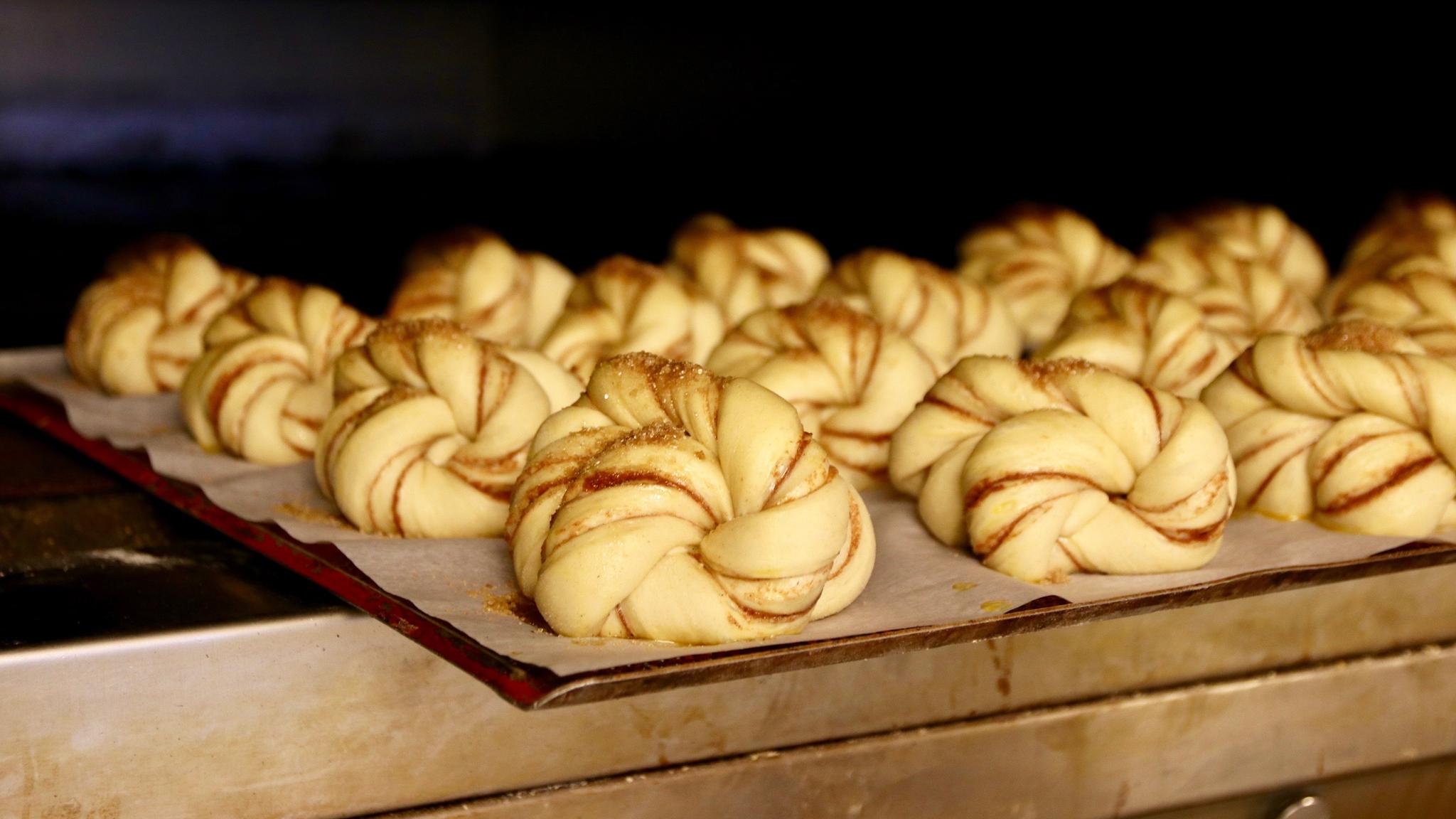 Cinnamon buns on a tray ready to go in the oven