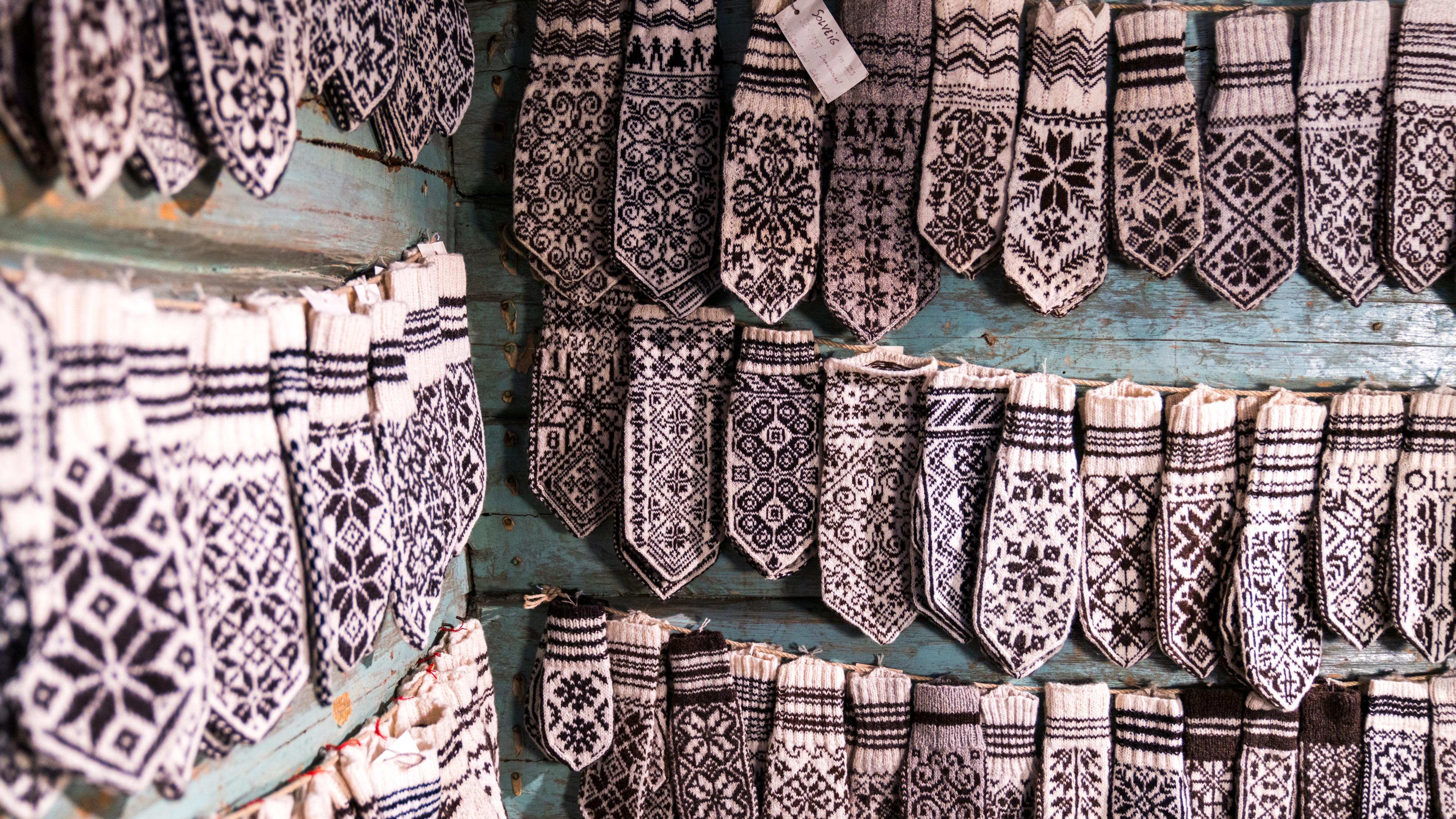 Selbu mittens in different versions hanging on the wall at Selbu Husflidscentral.