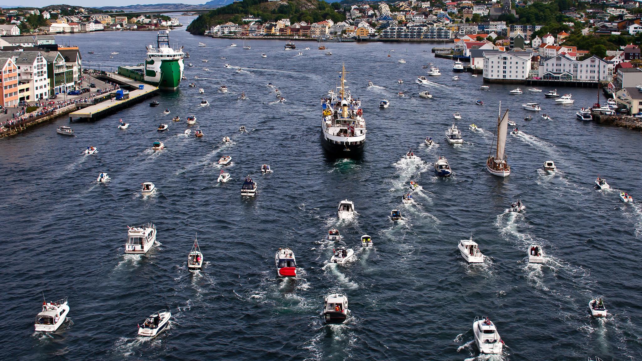 A myriad of large and small boats travelling towards Kristiansund in the Northwest, Fjord Norway