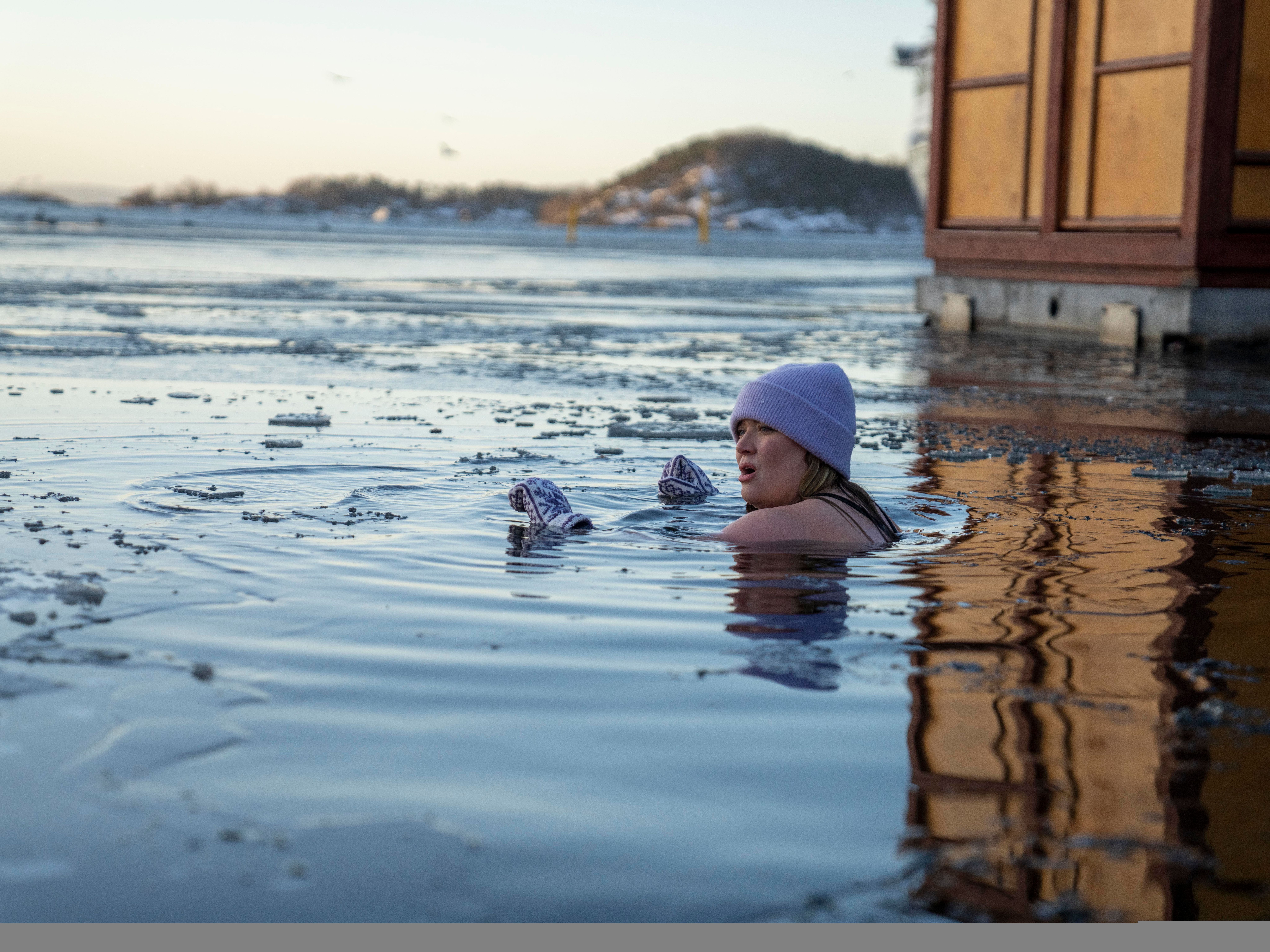 A girl ice bathing in the Oslo fjord, Eastern Norway