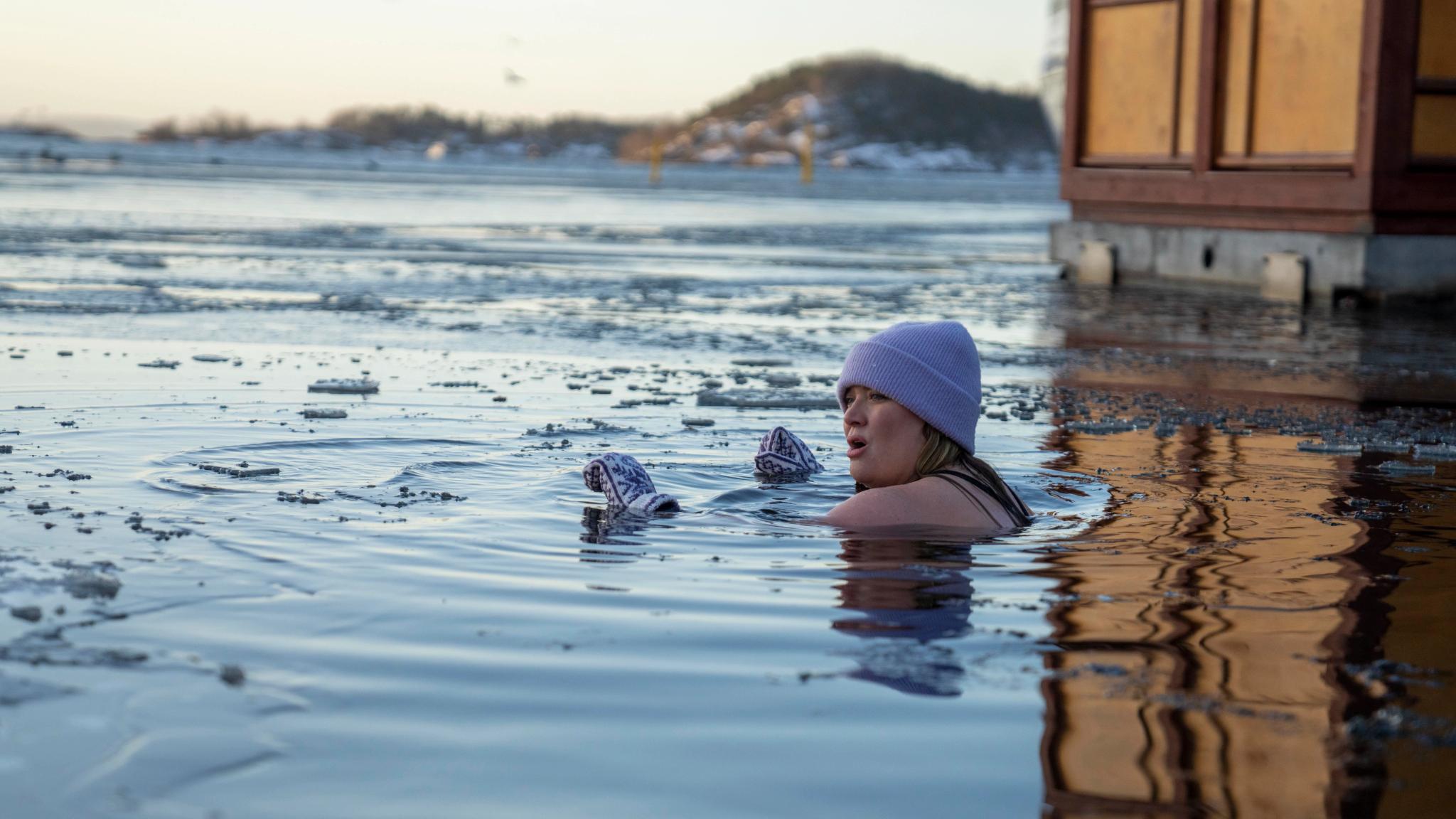 A girl ice bathing in the Oslo fjord, Eastern Norway
