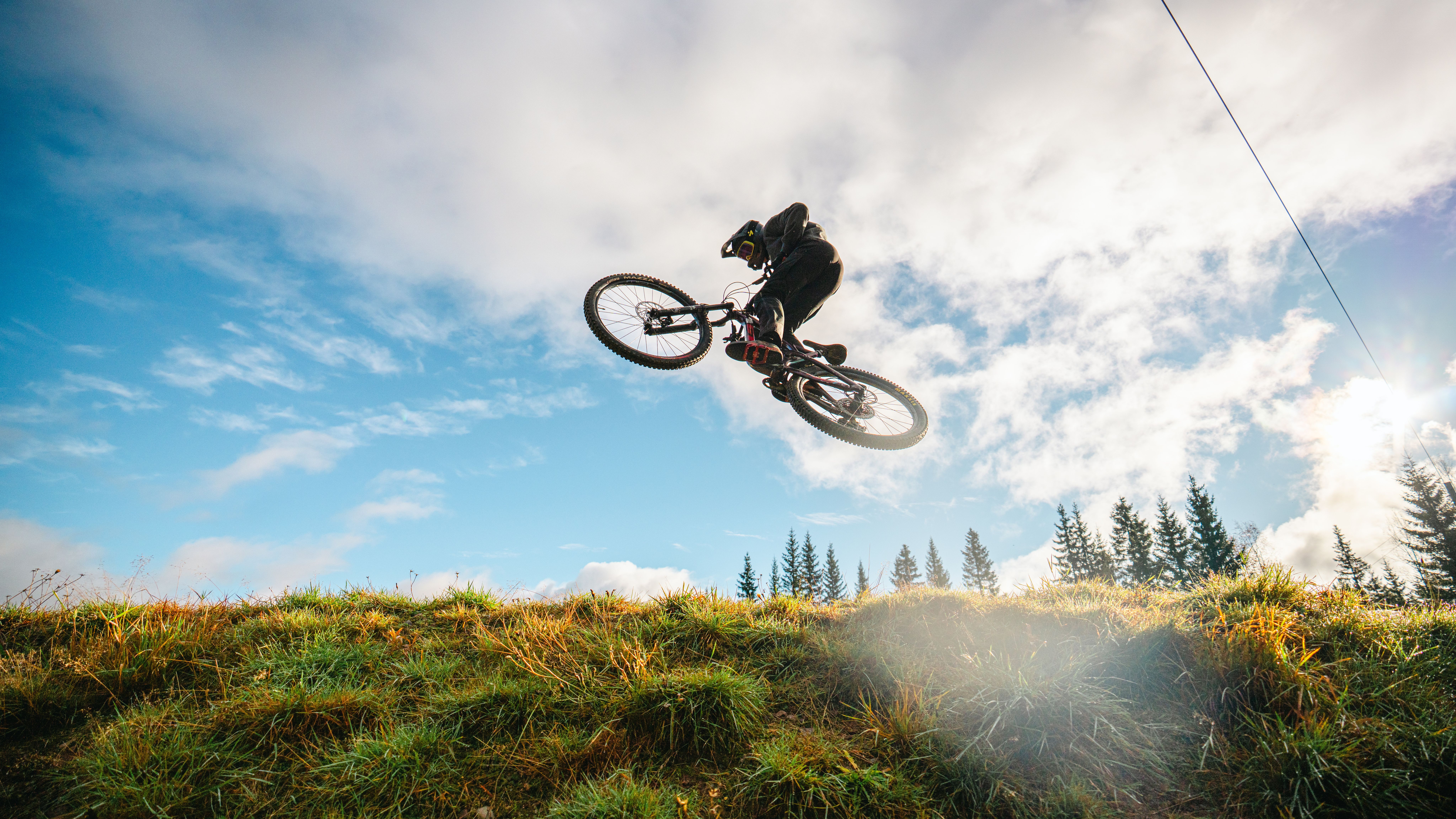 A boy on a bike in mid-air.